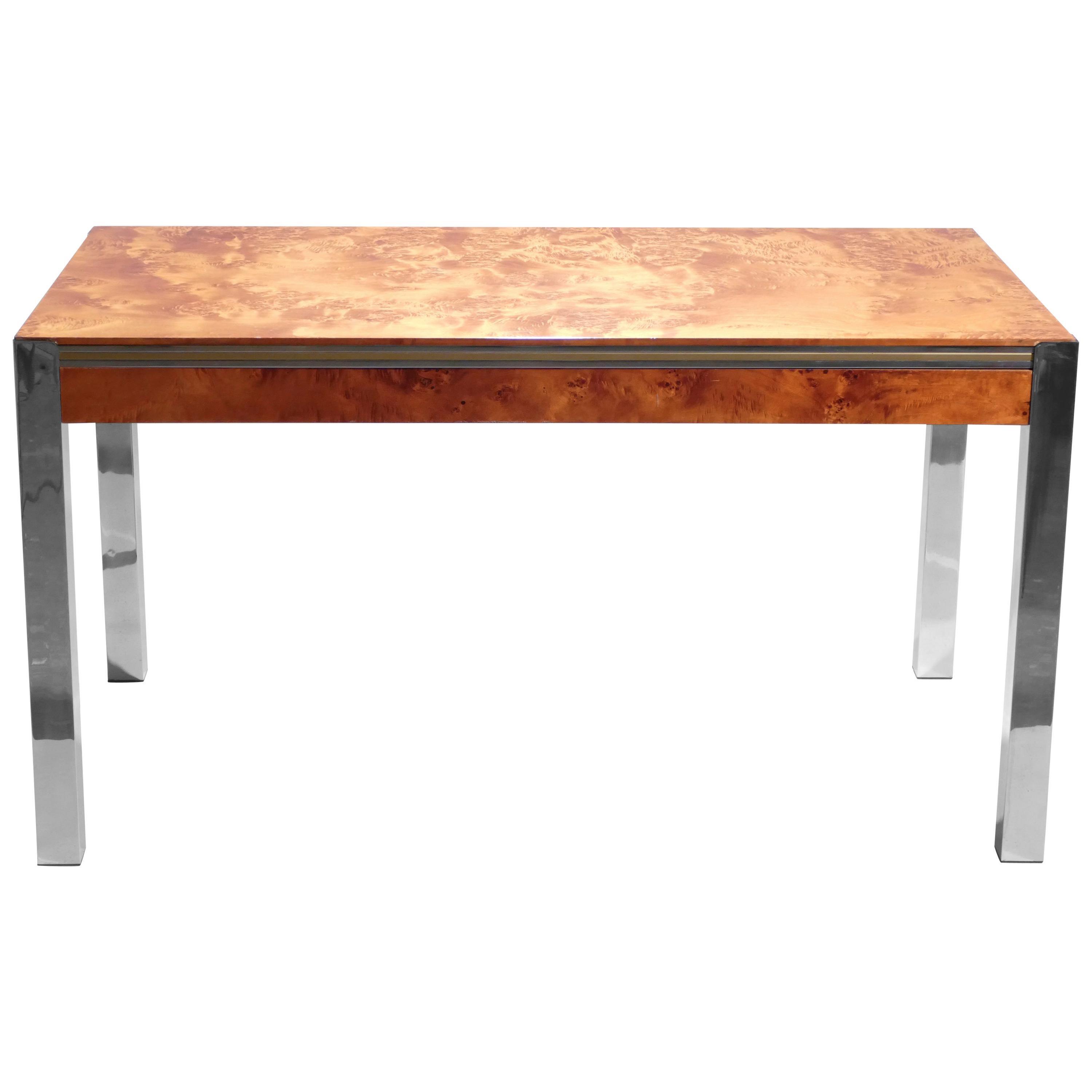 Famed midcentury designer Willy Rizzo often used burl wood in his designs, and it’s not hard to see why in this dining table. The rich material, when lacquered and hit with light, has a remarkably warm and bright appearance. Combined with shiny