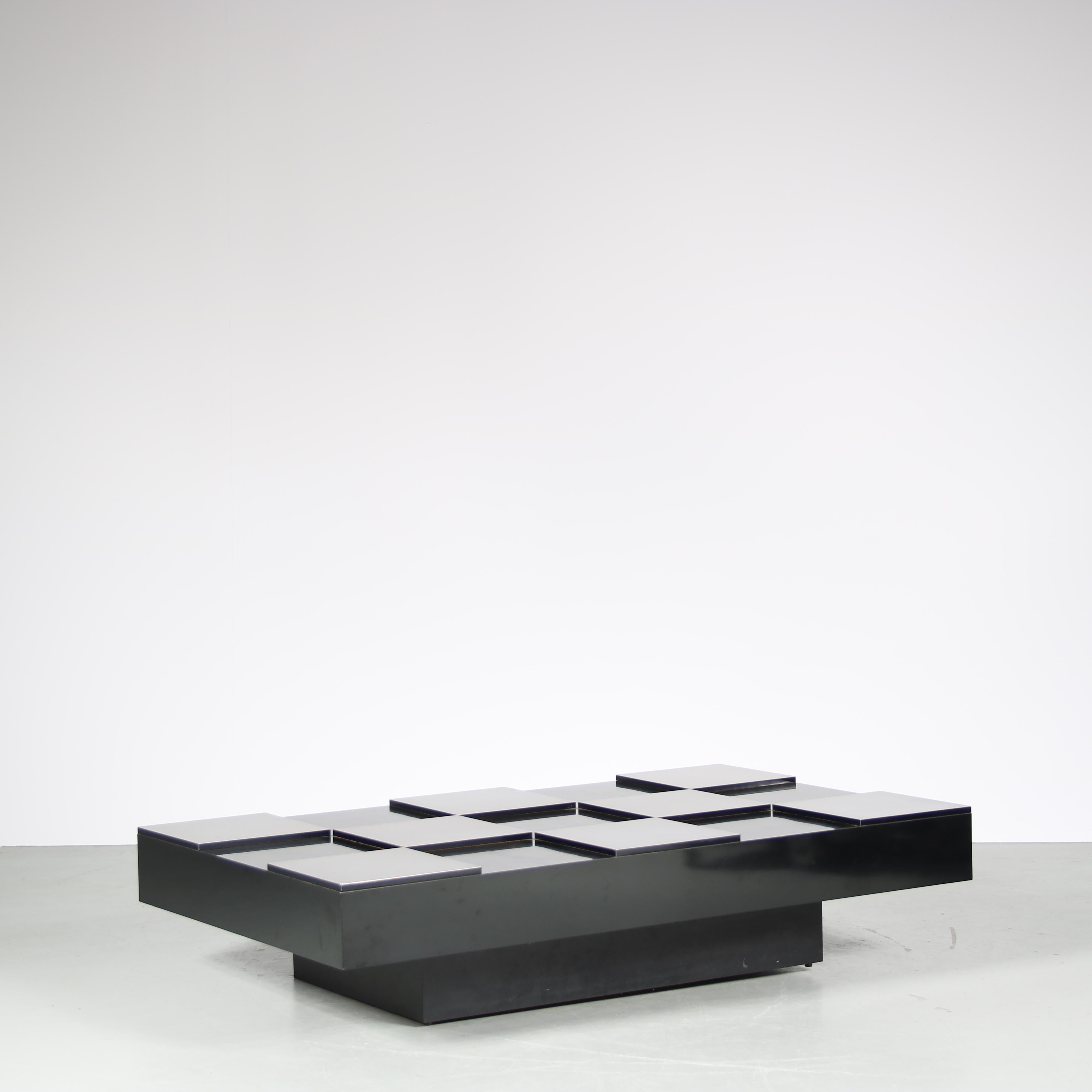 A rare “checkerboard” coffee table designed by Willy Rizzo, manufactured in Italy around 1970.

This wonderful piece is made of high quality black laminated wood with bright aluminium. The materials are combined into a checkered pattern to the top