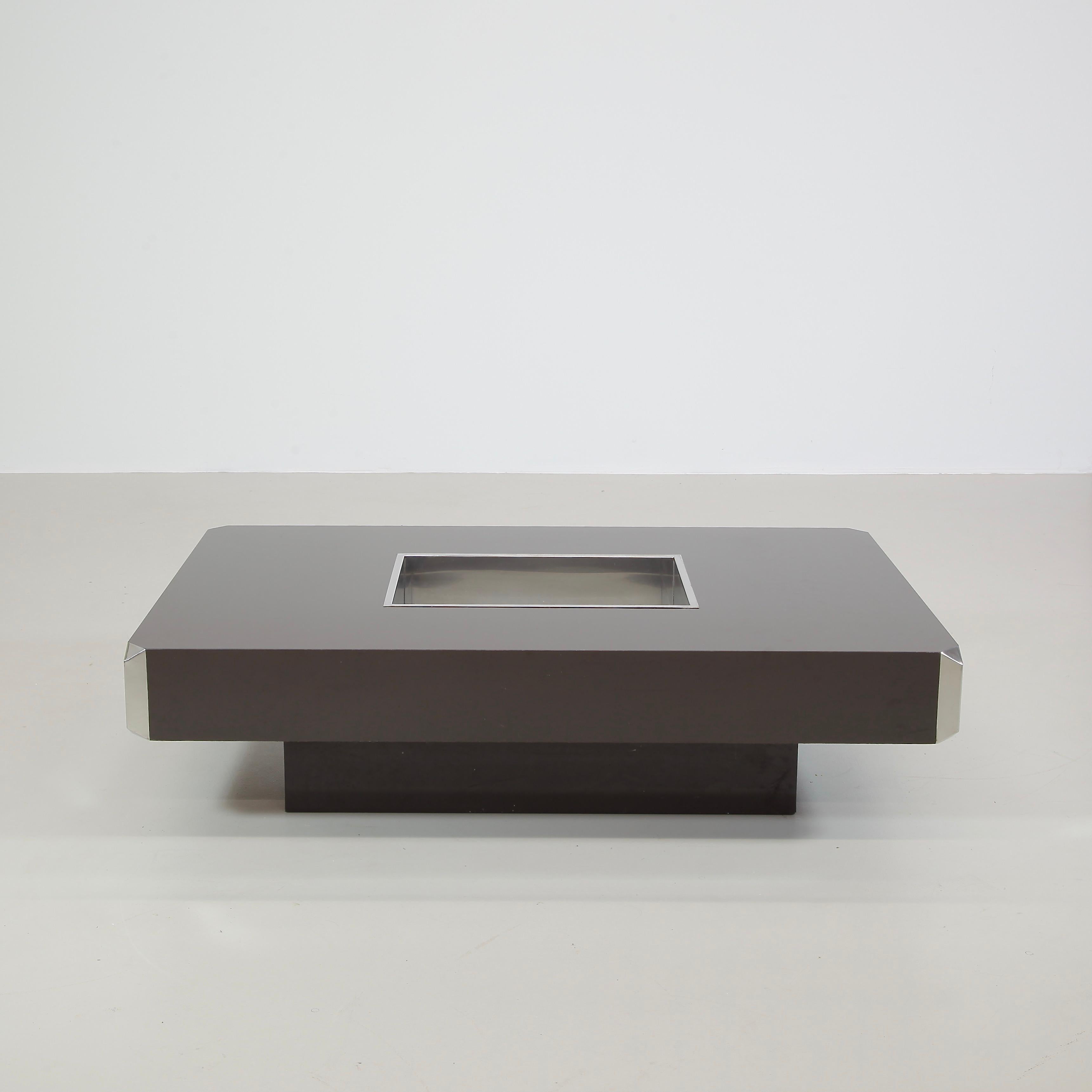 Coffee table designed by Willy Rizzo. Italy, Mario Sabot, 1974.

Model: Alveo, dark brown Formica covered wooden table construction with inserted chromed tray and chromed corner pieces. This is the classic Willy Rizzo coffee table which was