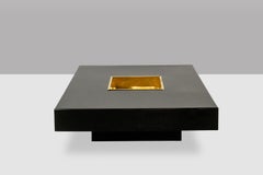 Willy Rizzo. Coffee table in black lacquered wood and gold-plated brass. 1970s