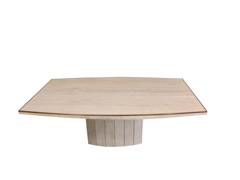 Dining table by Willy Rizzo for Jean Charles, France 1970’s. 

High quality piece out of travertine and nice solid brass details like the edges around the top and the base. The table has a beautiful curved form and has the right patina.

1970s -