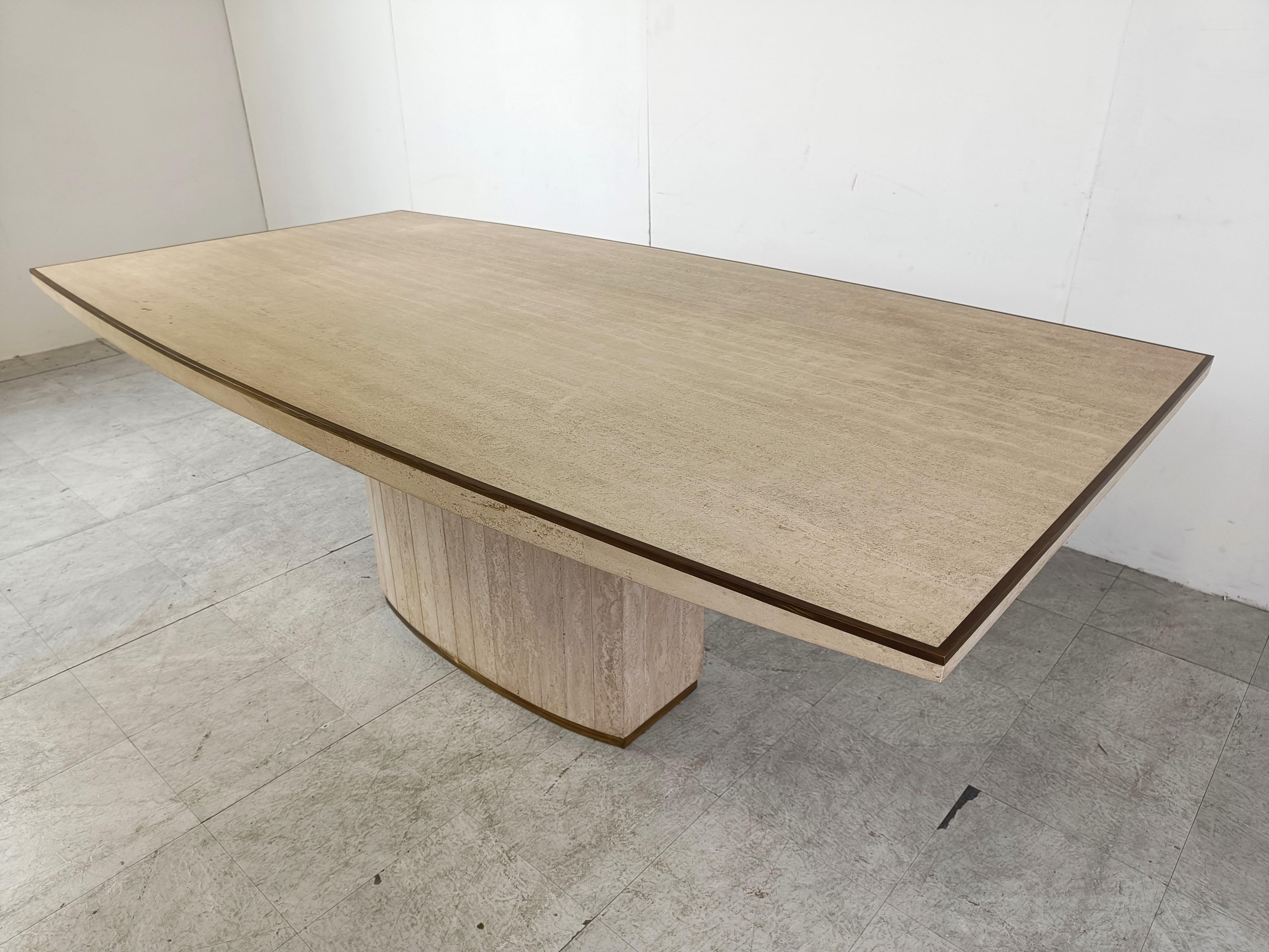 Dining table by Willy Rizzo for Jean Charles, France 1970’s. 

High quality piece out of travertine and nice solid brass details like the edges around the top and the base. The table has a beautiful curved form and has the right patina.

1970s -