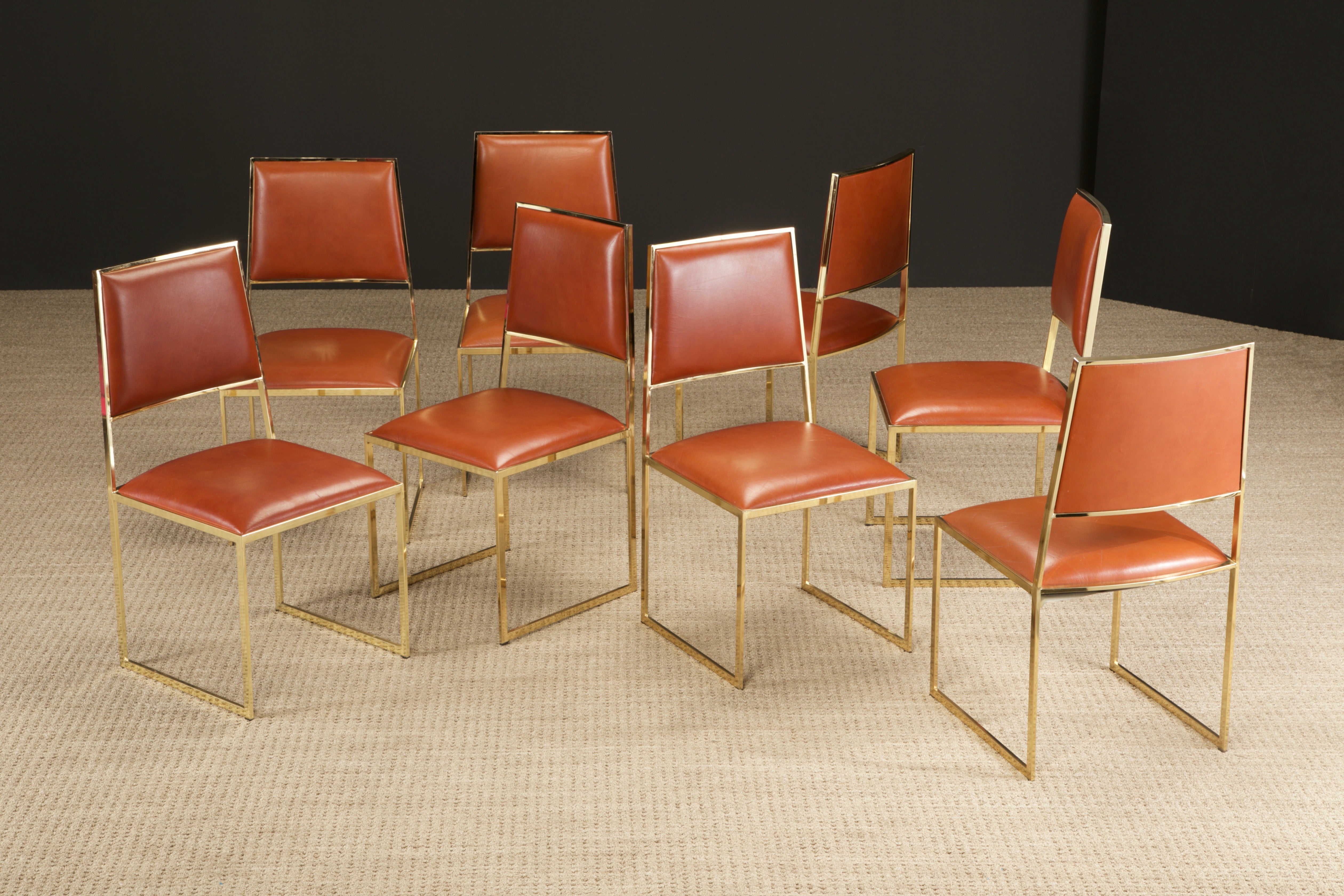 A beautiful set of eight (8) dining chairs by Willy Rizzo for Cidue, Italy circa 1970, featuring gorgeous cubist brass frames and cognac colored leather. Signed with Cidue labels reading 'Made in Italy, Cidue, elementi d'arredo - carrè / vi'.