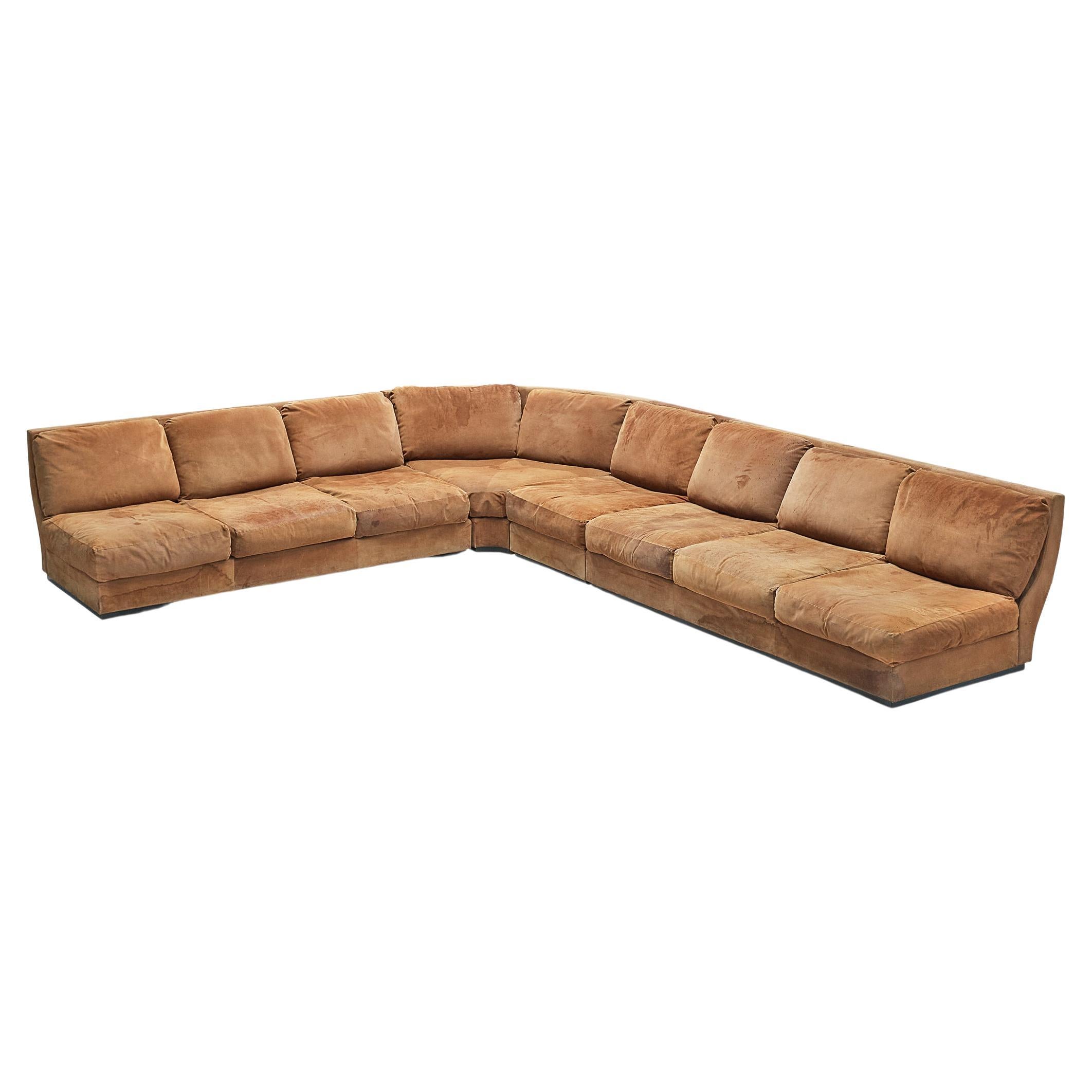 Willy Rizzo for Mario Sabot, sectional corner sofa, suede, Italy, 1970s. 

Grand modular corner sofa by Italian designer Willy Rizzo for Mario Sabot. This sofa is executed in beautiful warm cognac suede and consists out of two three-seater pieces,