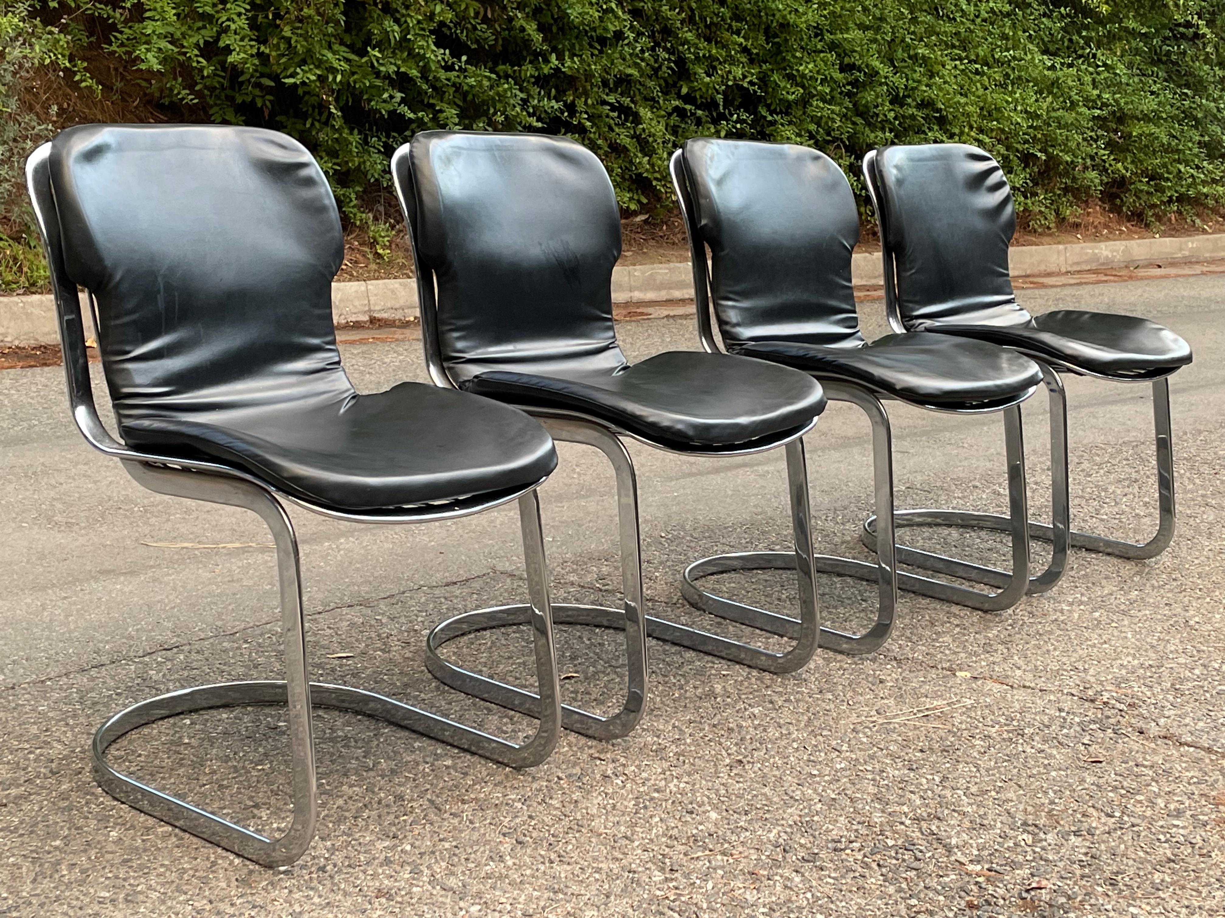 Set of (4) Vintage Mid Century 70's Willy Rizzo Chrome Dining Chairs for Cidue Elementi D’Arredo-Carre.

Designed by Willy Rizzo.
Made in Italy.
Chrome frame and black faux leather seat cushions.
In very good vintage condition. Chairs are SIGNED