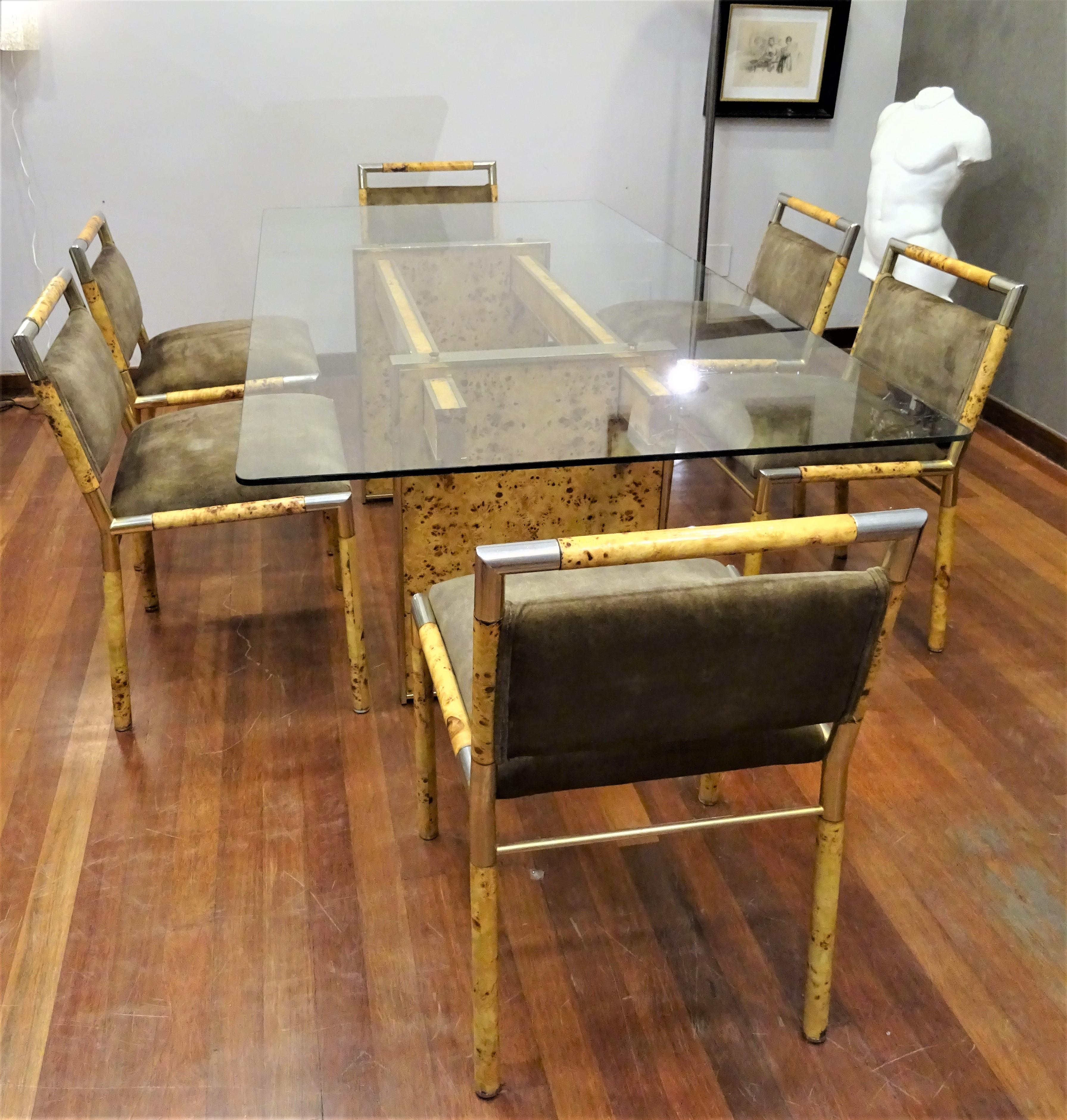 Italian dining table and chairs attributed to Willy Rizzo, 70s.
Spectacular Italian midcentury design set made in the 70s attributed to Neapolitan designer Willy Rizzo. The set consists of a large table two meters long, with the glass top and the