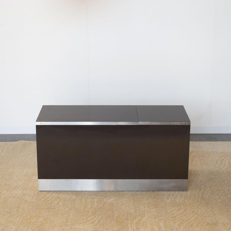 Small bar cabinet in brown glossy lacquered wood with opening door with satin aluminum edges designed by Willy Rizzo for Sabot Italia.

usually sold with sideboard in stock in our 1stdibs show room.