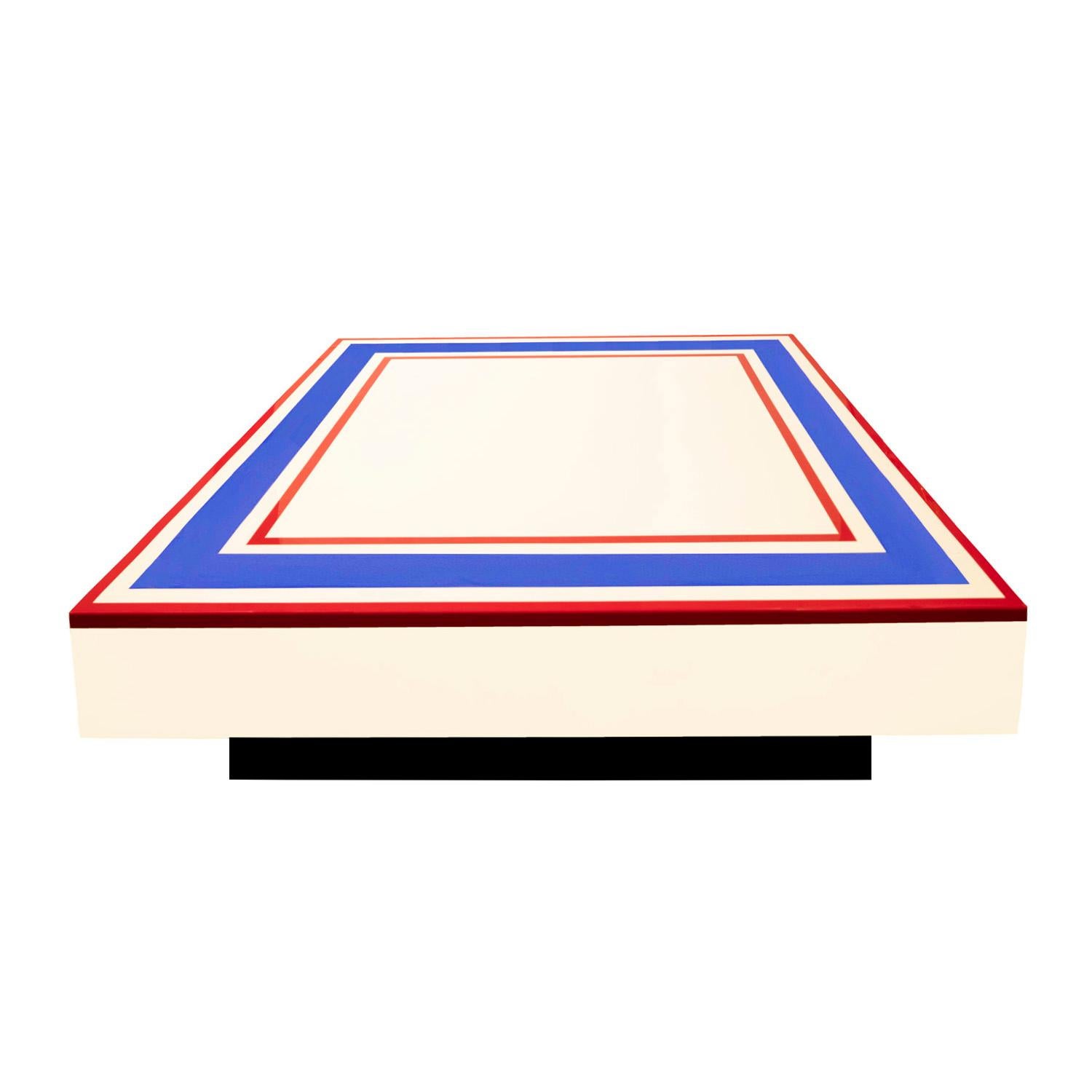 Stunning lacquered coffee table in white lacquer with graphic concentric red and blue lacquer elements by Willy Rizzo, Italian 1970's (signed on side 