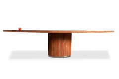 Willy Rizzo. Large table in orange-red travertine. 1970s.
