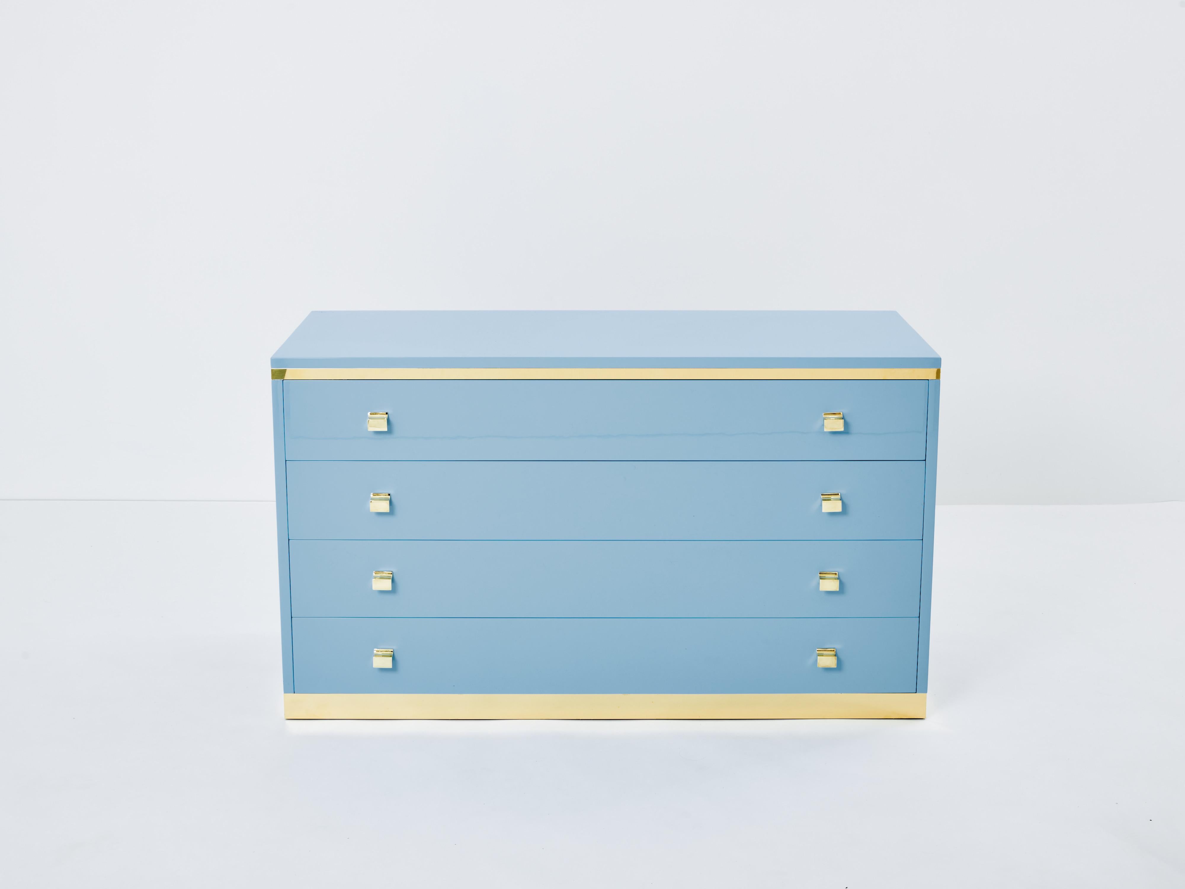 With a beautiful pastel blue lacquer finish, and brass standing, handles and details above the four drawers, this beautiful commode carries a stellar Italian mid-century aesthetic into the contemporary home. Its boxy yet sophisticated style is