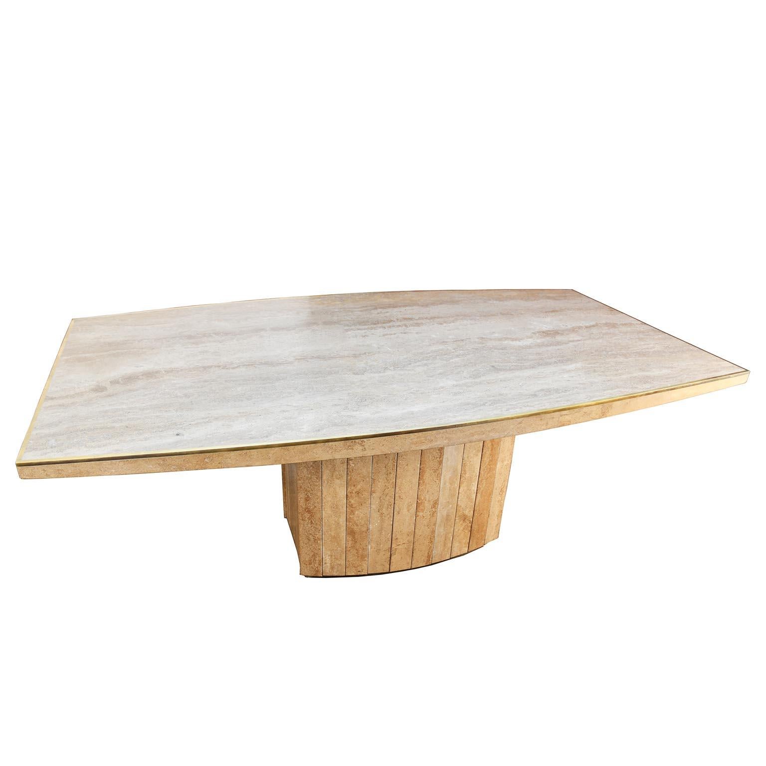 Dining table design Willy Rizzo, executed by Jean Charles around 1970s. The table is made of tarvertine, the top is in one piece, finished with an elegant brass edge.
The base is also made of tarvertine slabs, which shape has a fine bend. At the