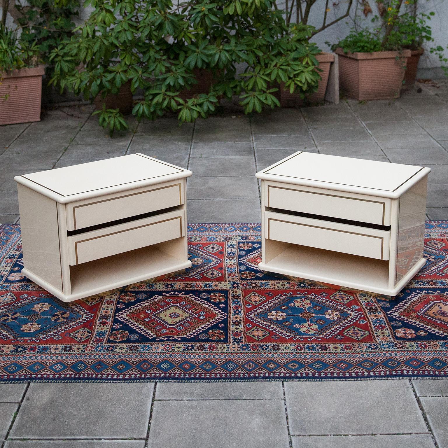 Elegant nightstands made by Maria Sabot and attributed to Willy Rizzo, Italy 1970s. Cream white lacquered surface with brass details.
    