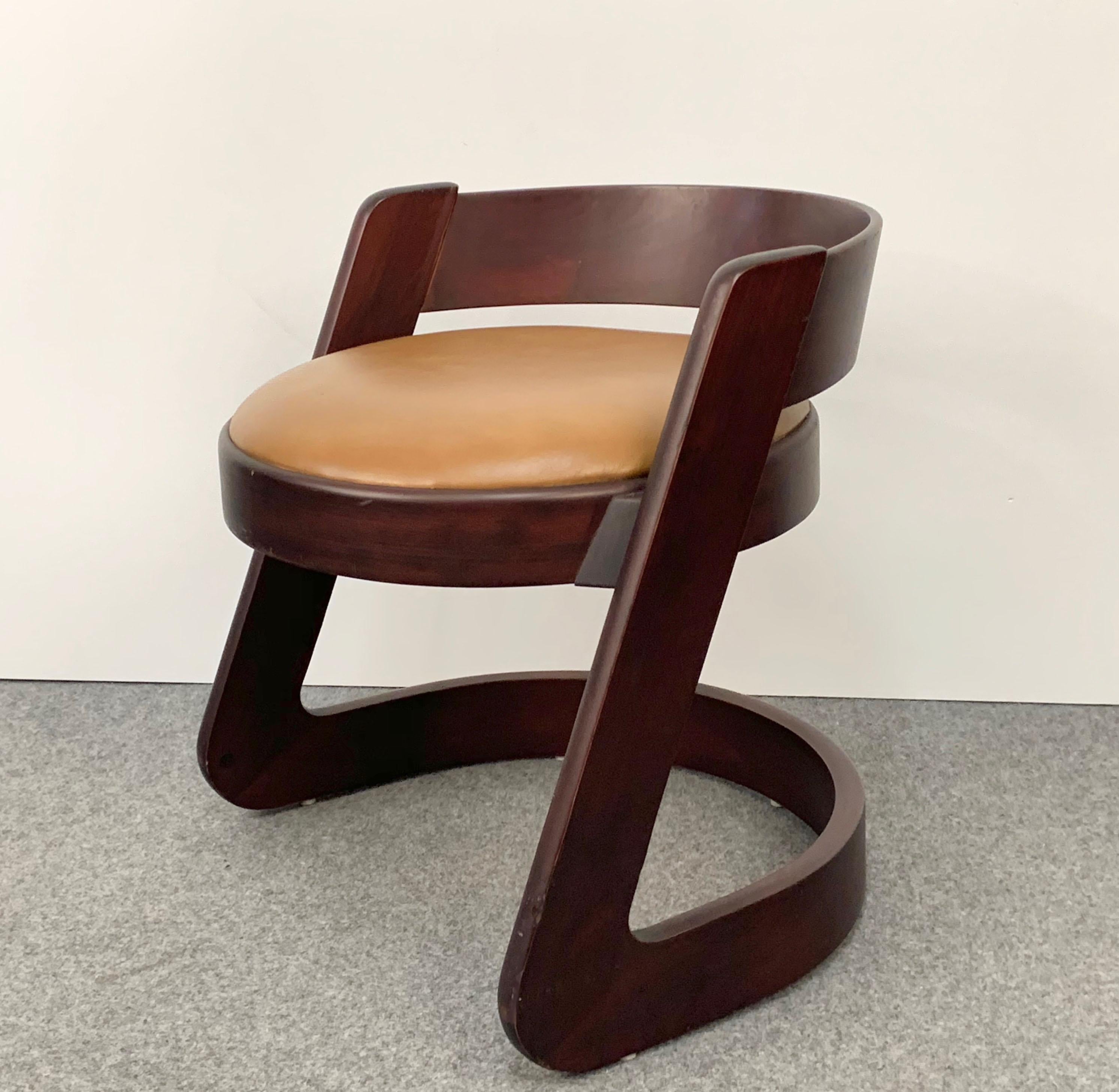 Delightful and petit midcentury wood chair designed by Willy Rizzo for Mario Sabot. 

This piece was produced during 1970s in Italy. The dark wood in contrast with the beige leather and the straight vertical lines against the curved horizontal