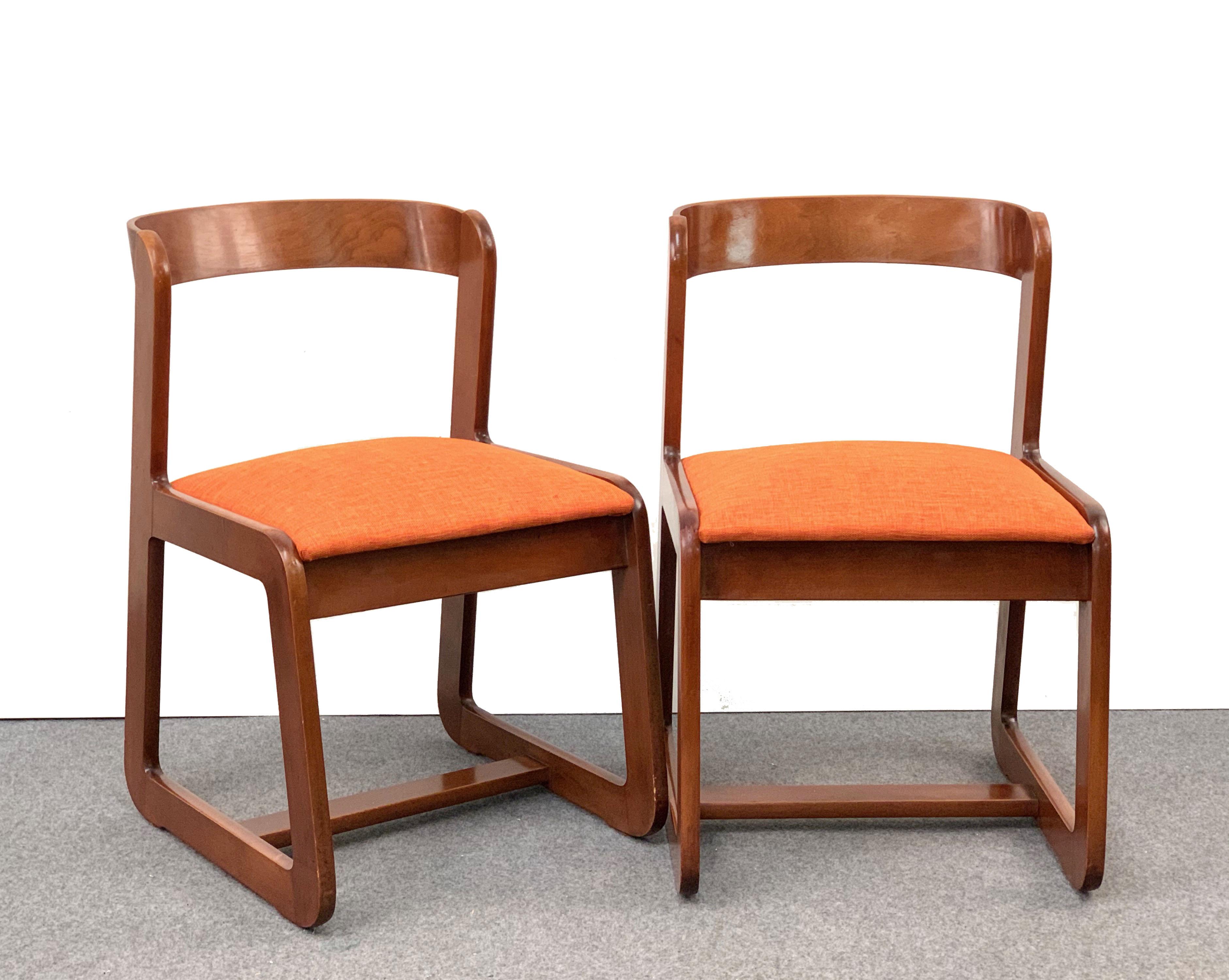 Beautiful set of six midcentury wooden chairs with orange fabric seats. These chairs were designed by Willy Rizzo for Mario Sabot.

This marvelous set was produced in the 1970s in Italy. The curved wood back has sinuous lines, while the upholstery