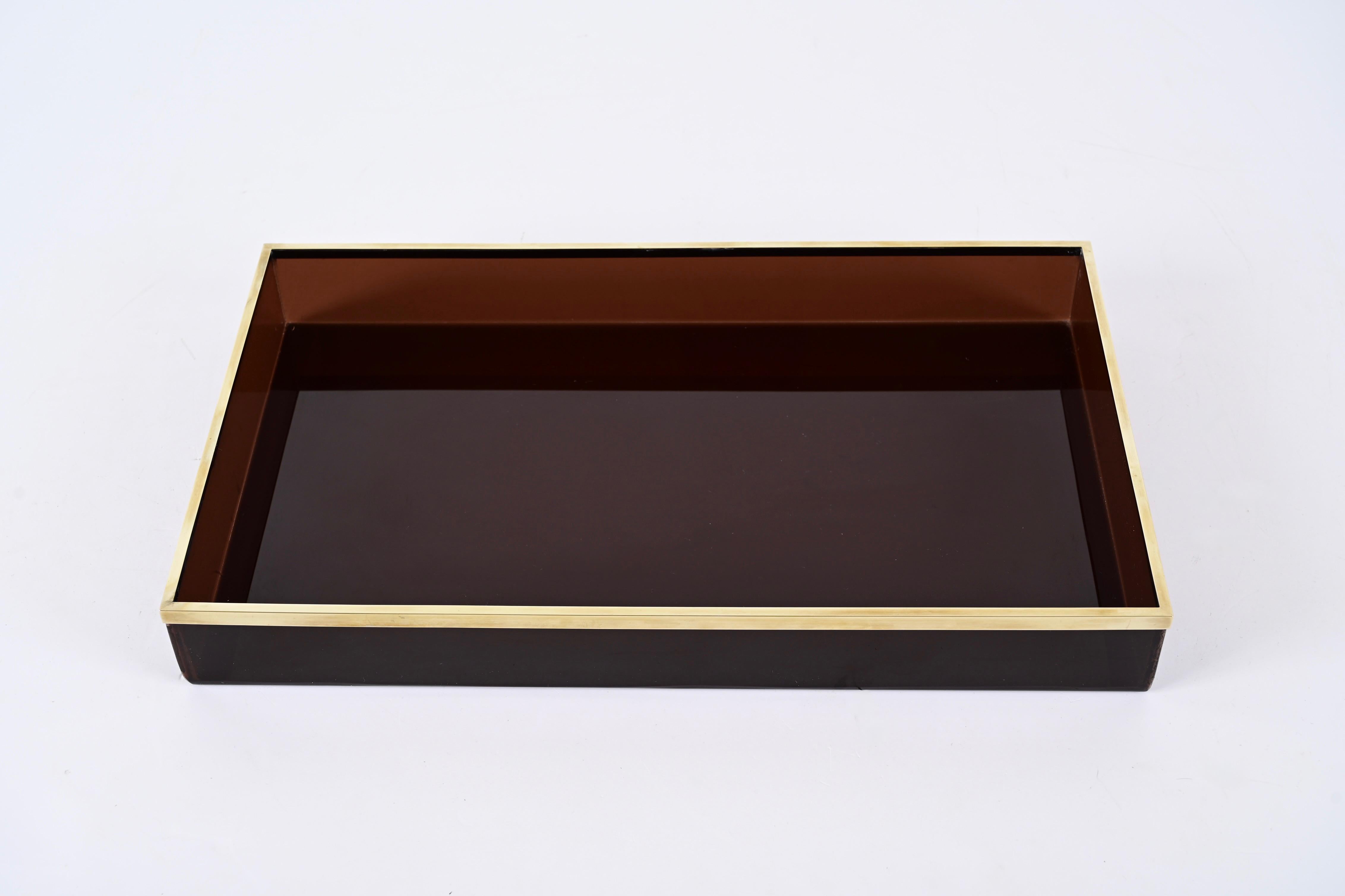 Astonishing midcentury smokey lucite and brass serving tray. Willy Rizzo produced this incredible piece in Italy during the 1970s for Christian Dior.

A real iconic tortoise and lucite serving tray with iconic straight lines from midcentury