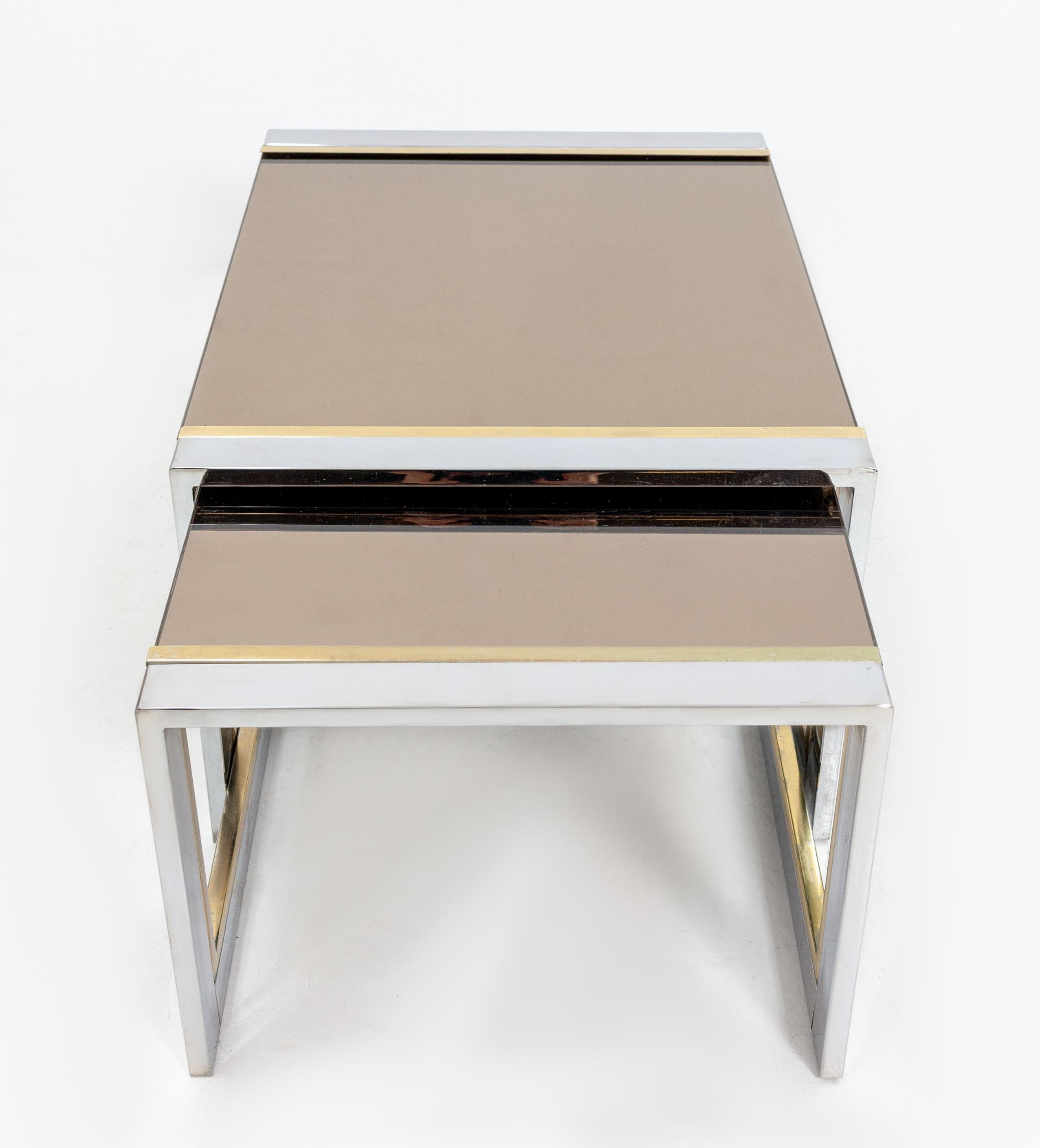 Lovely design by Willy Rizzo Italian designer. 1970s, two side tables. Made off polished steel and brass,

With the original smoked mirror glass. Very stylish tables. Good condition.




Measures: Height 33 cm, width 59 cm, depth 46 