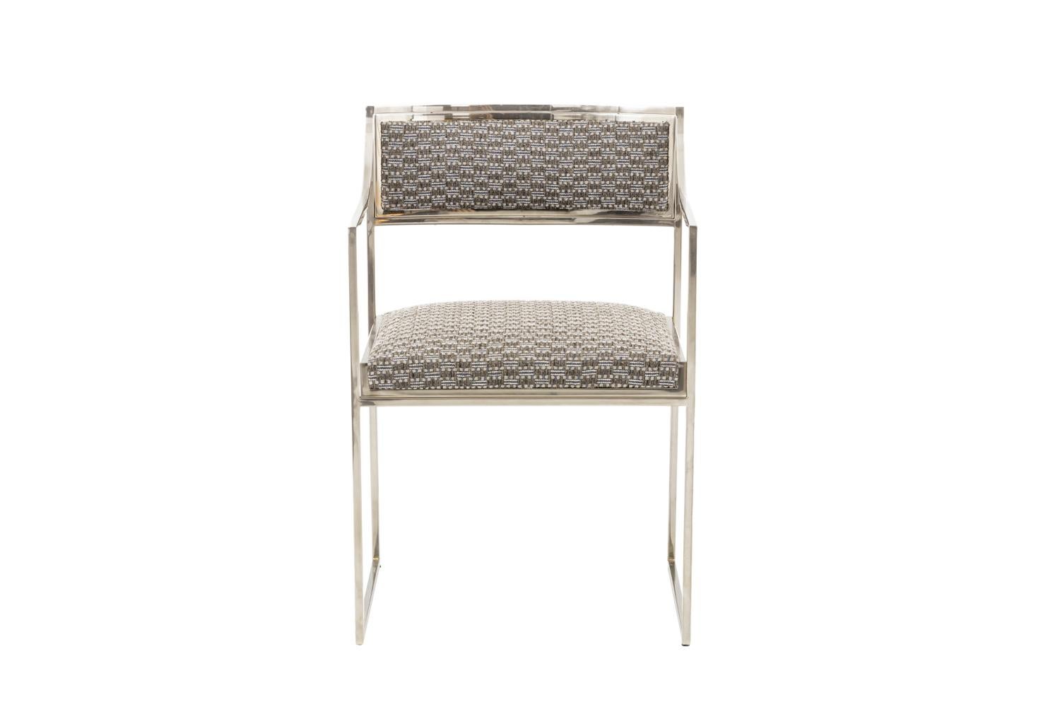 Willy Rizzo, attributed to.
Chromed metal armchair standing on two rectangular legs composed by squared metal sticks going up to form sloping arms.
Rectangular back and seat with a double frame.

Trim entirely reupholstered by our work shops with a