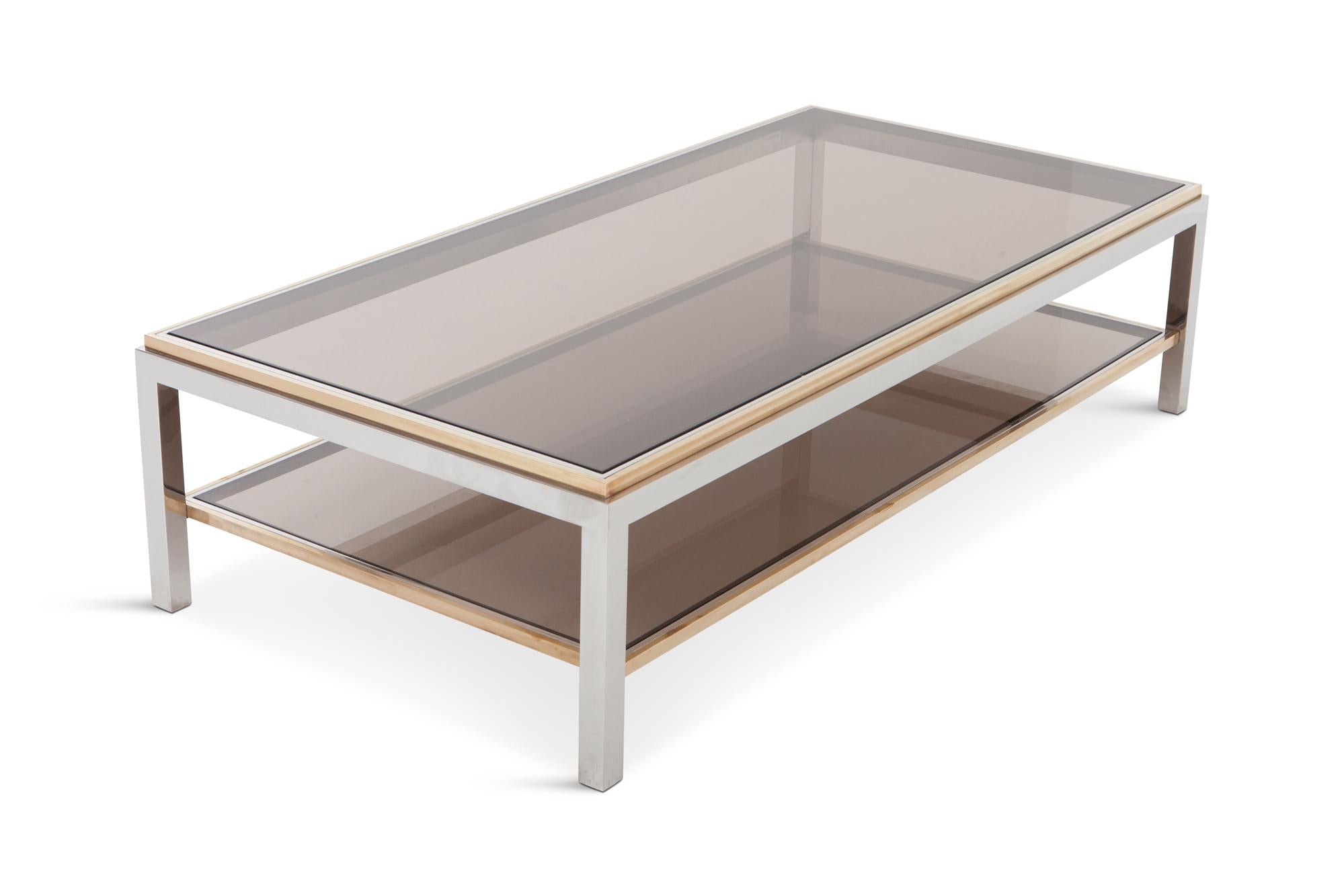 Brass, Chrome and smoked glass two tier coffee table, Willy Rizzo, 1970s. 

The chrome-plated steel frame is finished with brass edges, resulting in a stunning rich contrast. Both table top and second layer are fitted with dark smoked glass. Table