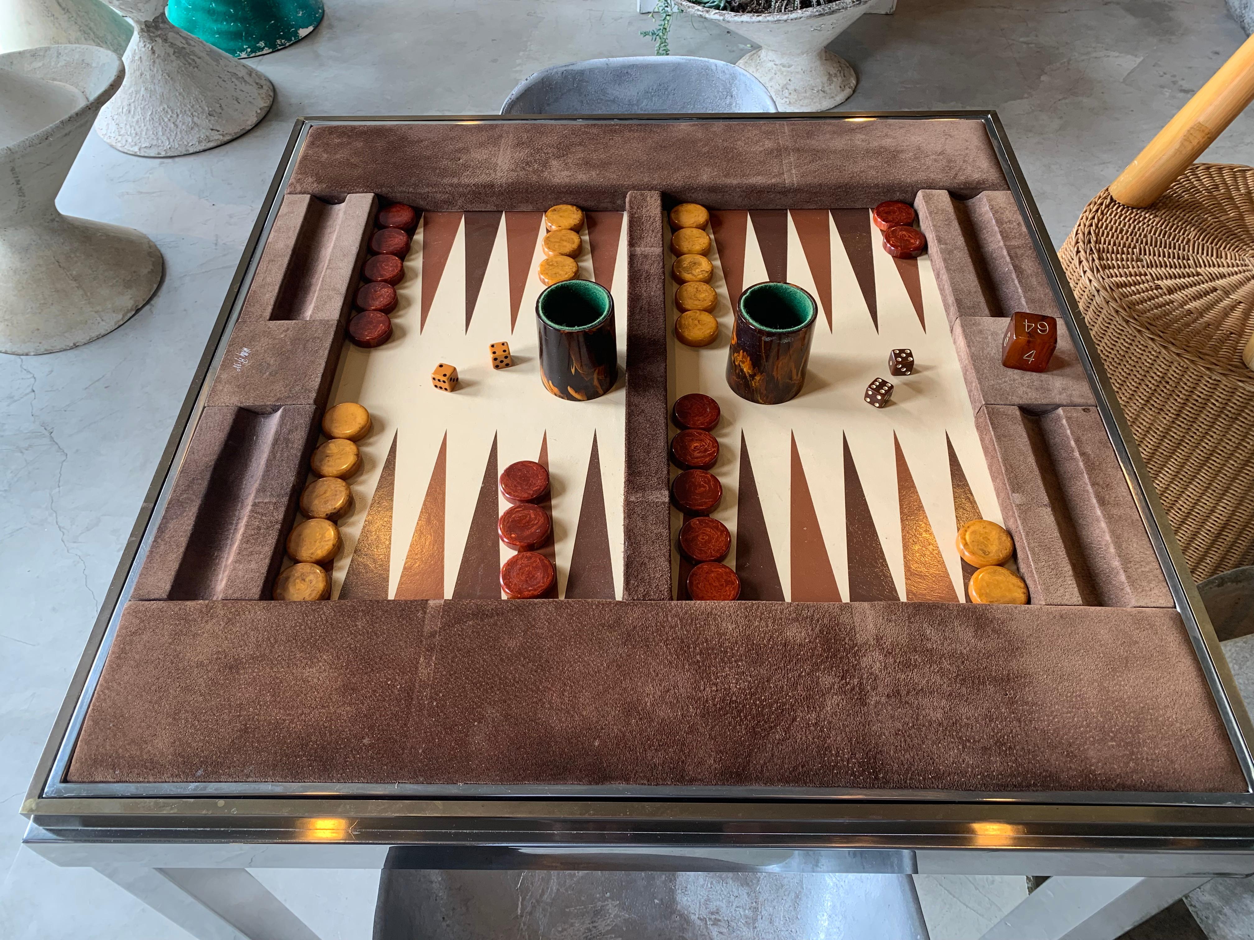 Completely original backgammon table by Willy Rizzo. Signed on the game board and on the metal frame. Game board made of brown Pecarry wild boar suede. Game board flips over to a beige Pecarry boar skin top for playing cards and natural seating.