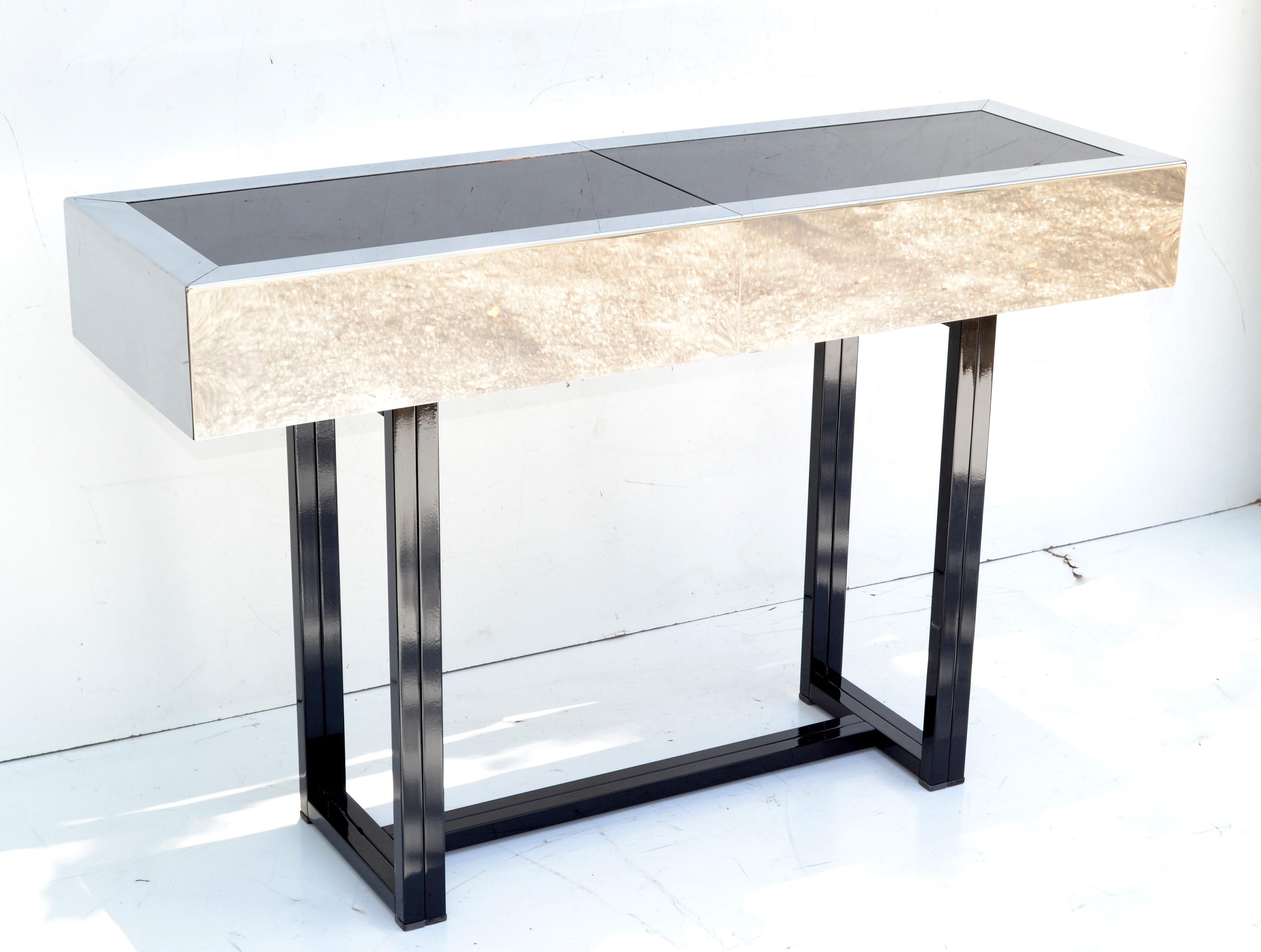 Very elegant bar console table Willy Rizzo Style made in Italy, circa 1970s.
Sturdy black powder coated steel frame with brushed steel bar frame & polished Chrome compartment.
Black mirrored glass top.
Mirrored glass measures: 43.25 x 11