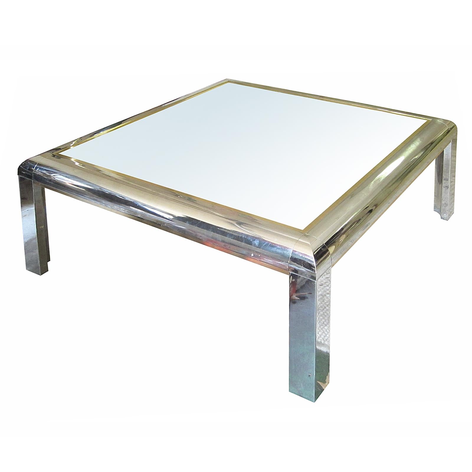 In the style of Willy Rizzo Italian chrome and gold-plated square brass coffee table, circa 1960s
Glass top.