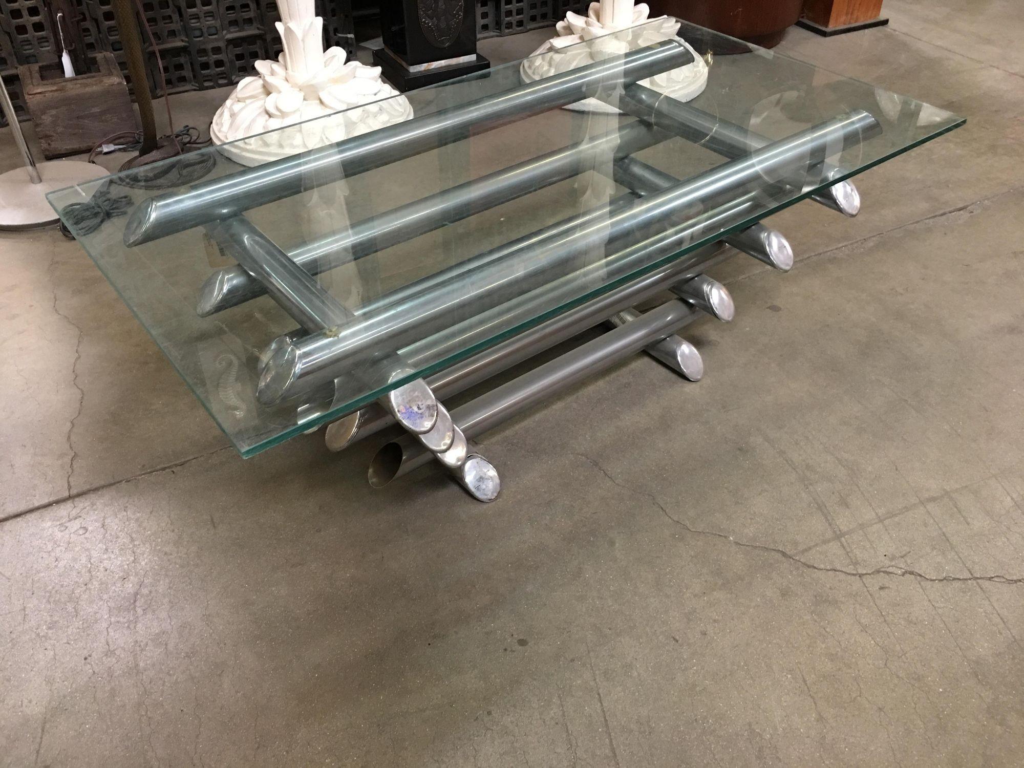 French chrome tubular steel coffee table with 8 layers of chromed metal tubes and a thick glass on top. In the style of Willy Rizzo.