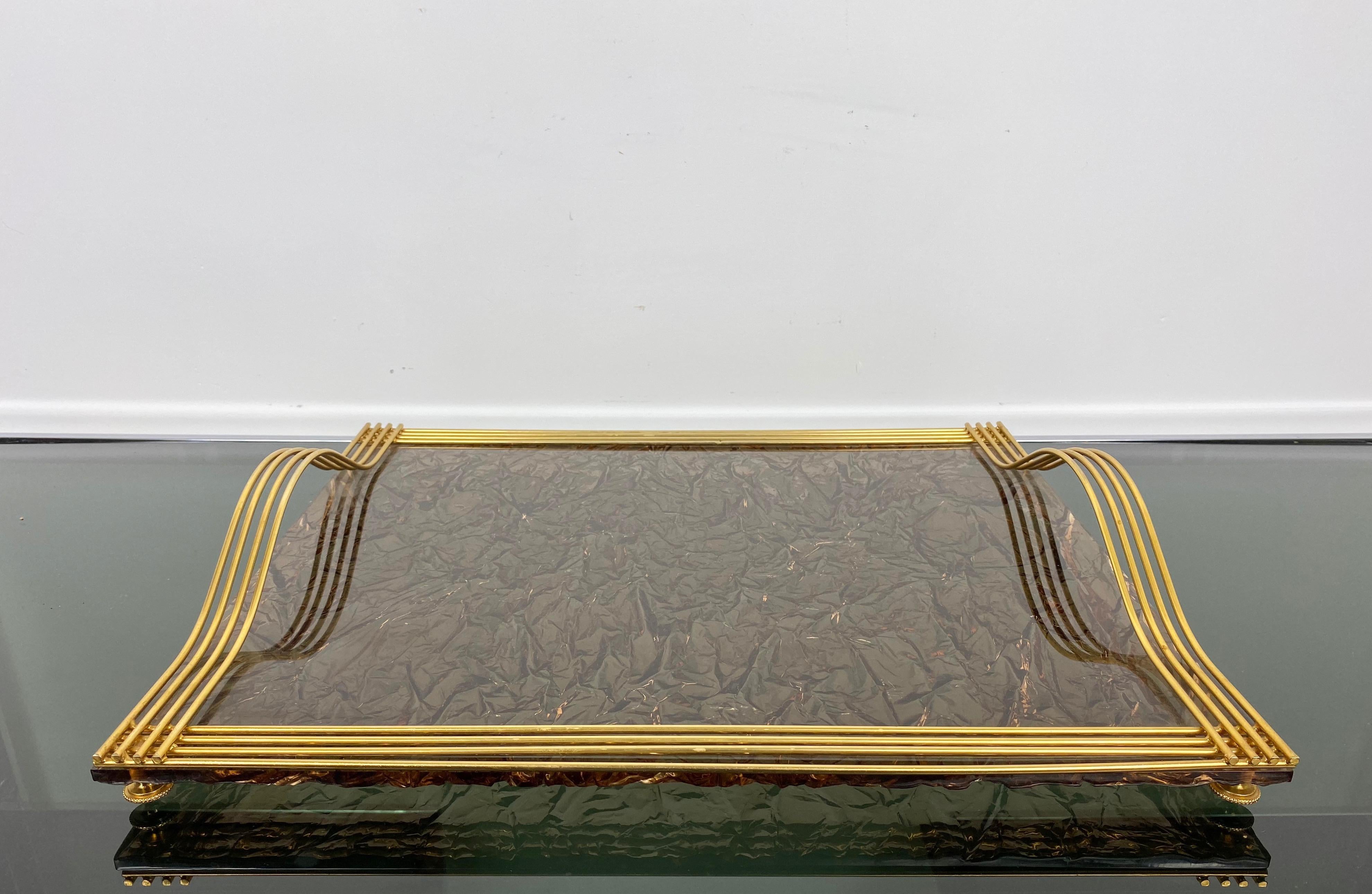 Serving tray in dark ice effect Lucite and golden metal borders and handles. In the style of the Italian designer Willy Rizzo, Italy, circa 1970.