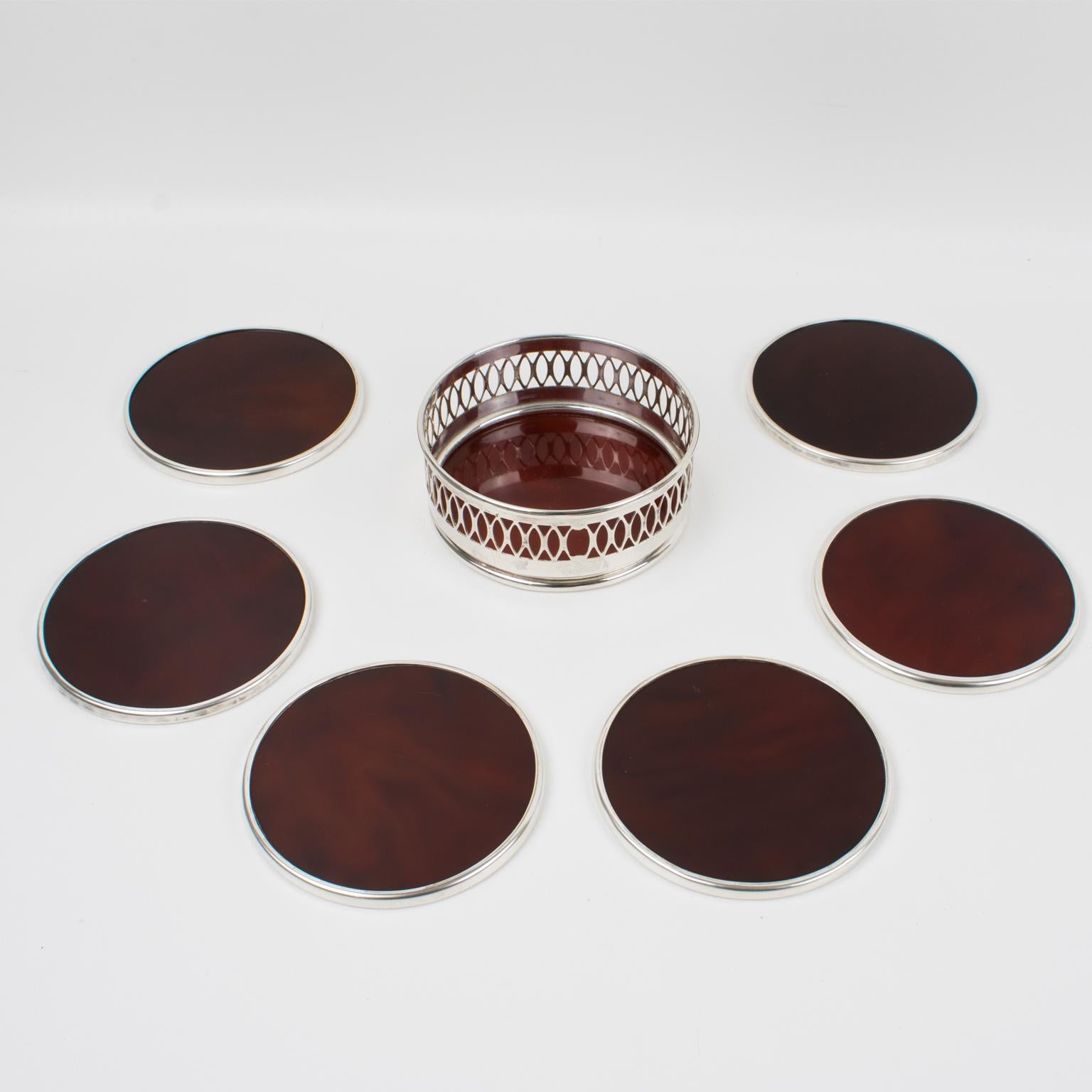 Lovely 1970s modernist barware set of six coasters with holder, design attributed to Willy Rizzo. Rounded shape with tortoiseshell (tortoise) translucent Lucite and chromed metal framing, note the framing is different from one side to the other.