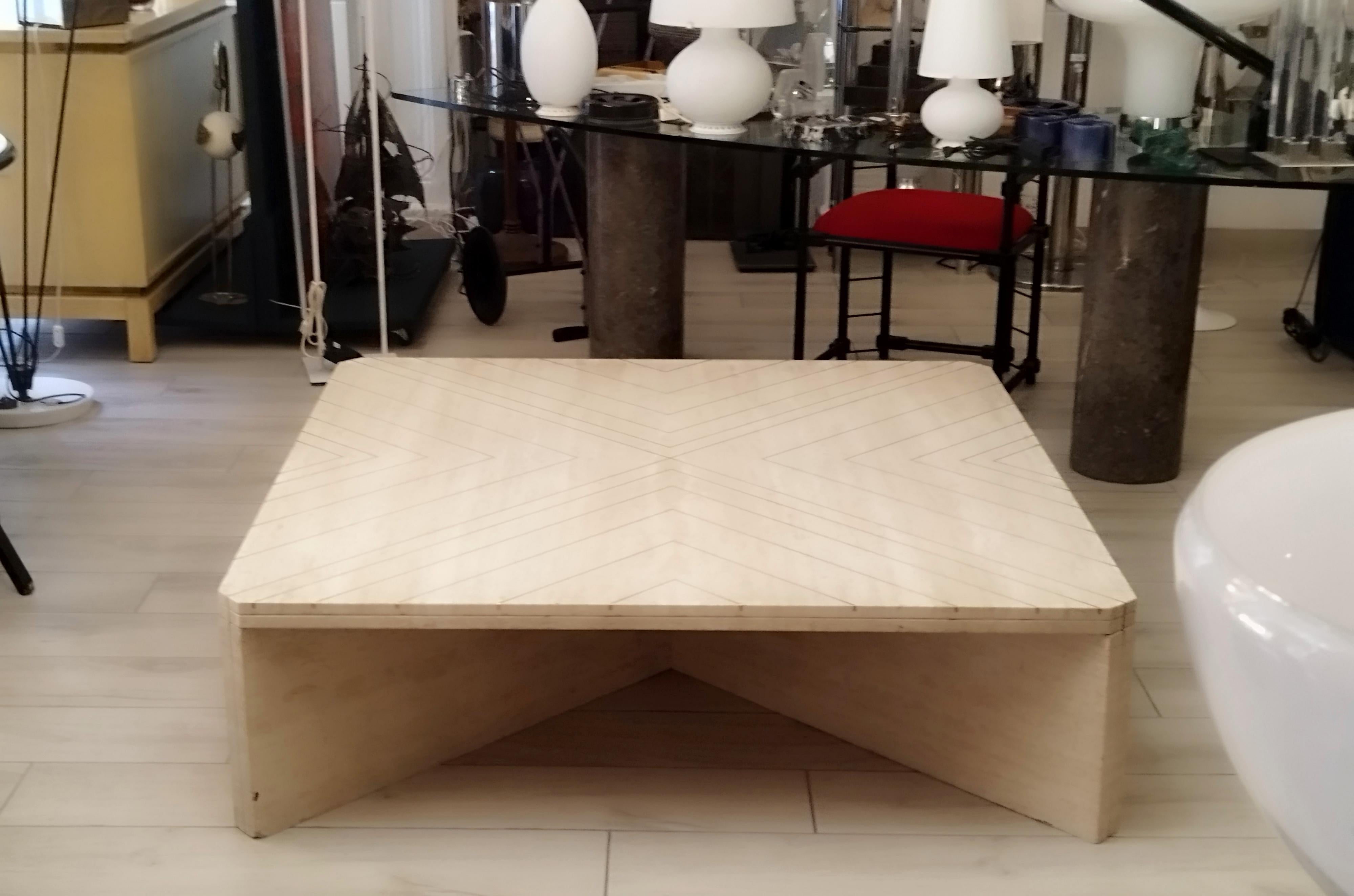 Rare coffee table by Willy Rizzo. The table features a fantastic solid brass arrow motif embedded in travertine. The inlay also runs to the base of the legs. The top is 4 cm thick.