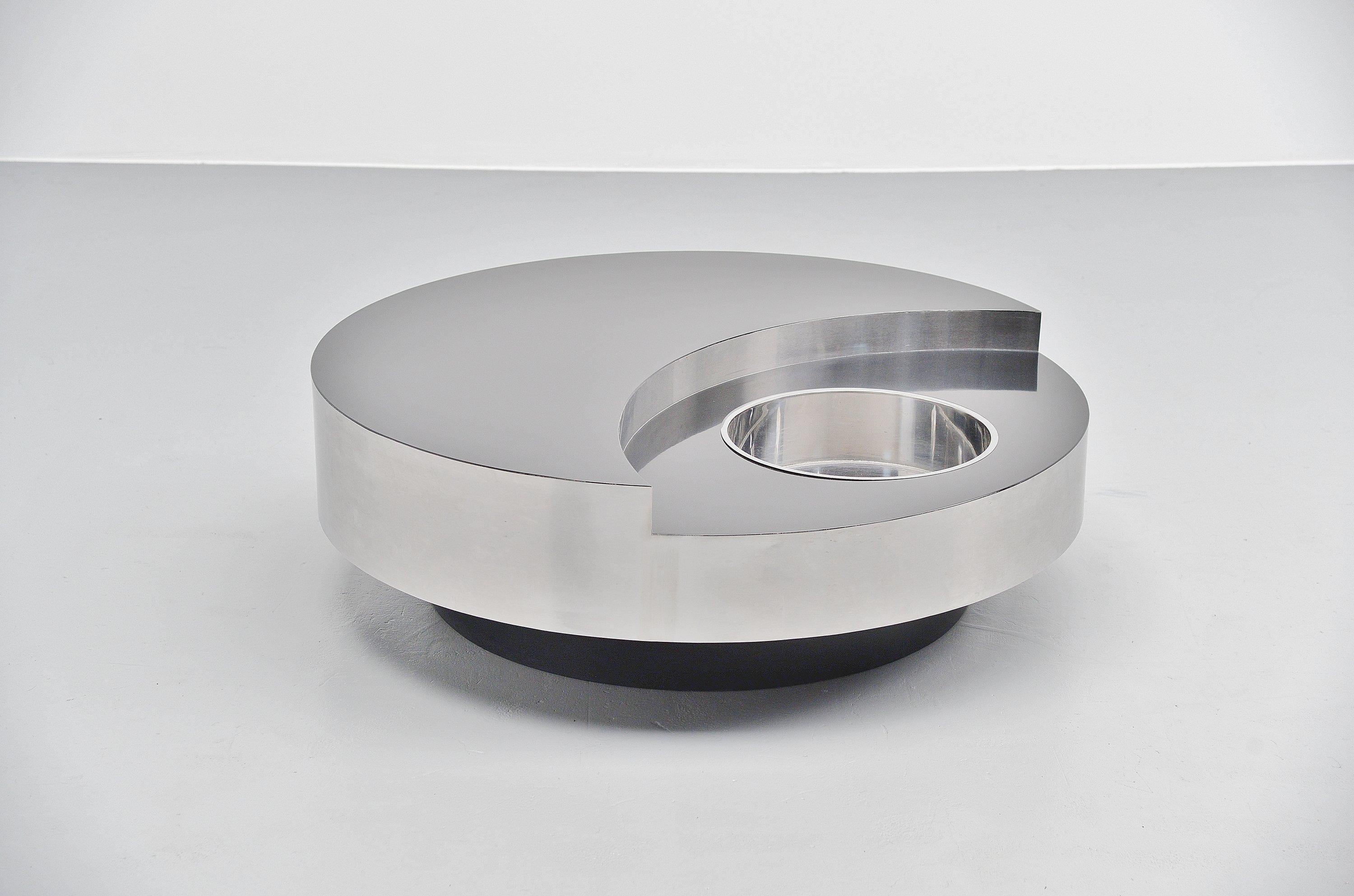 Spectacular 'TRG' revolving coffee table designed by Willy (William) Rizzo and manufactured by Studio Willy Rizzo, Italy, 1970. This is probably the nicest version of this table with a black laminated wooden top and stainless steel sides. With a