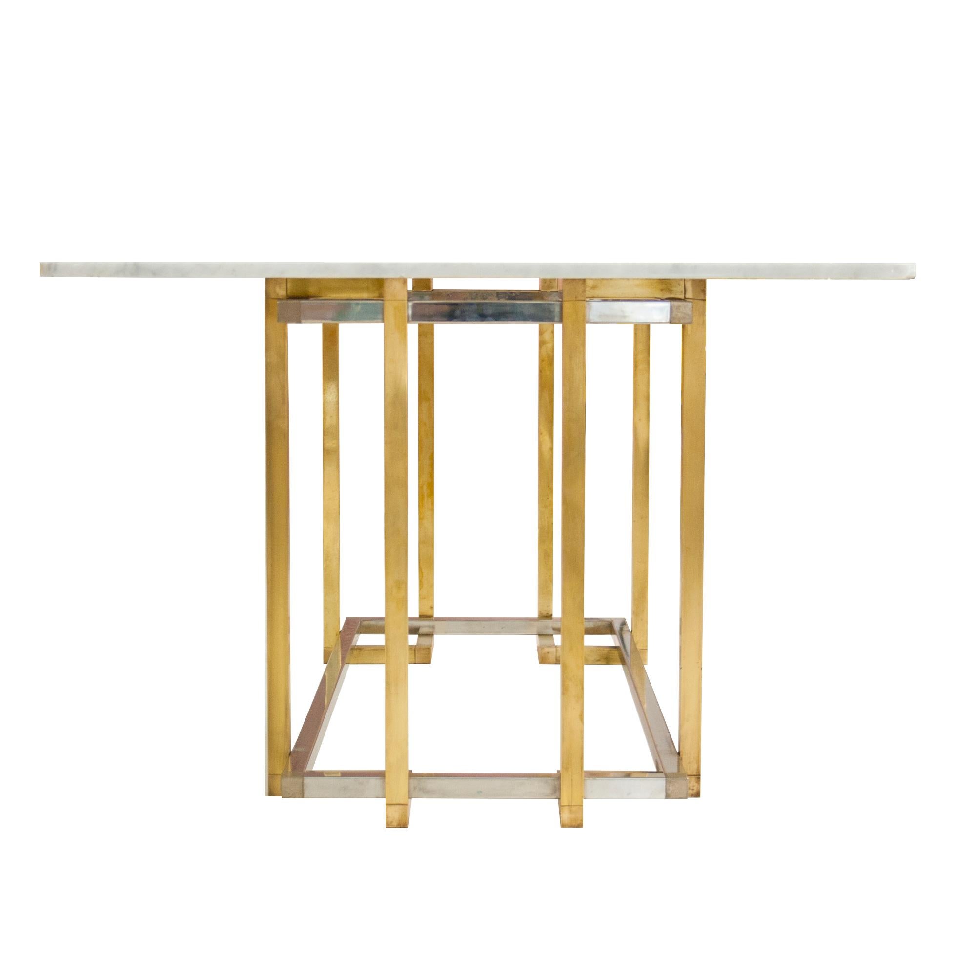Dining table designed by Willy Rizzo. It is made up of a Carrara marble top on a foot made of a square tubular structure in chromed and brass-plated steel.