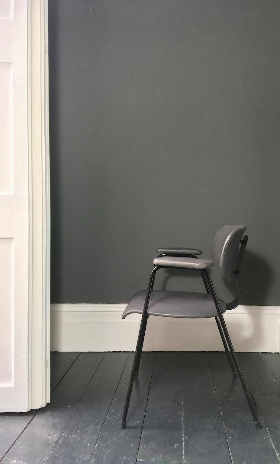 *** Spring Sale ***

Black metal desk or dining chair by the architect and designer Willy Van Der Meeren for Tubax, Belgium, early 1950s.

A very stylish piece with simple lines; the seat, back and armrests have been reupholstered in grey leather