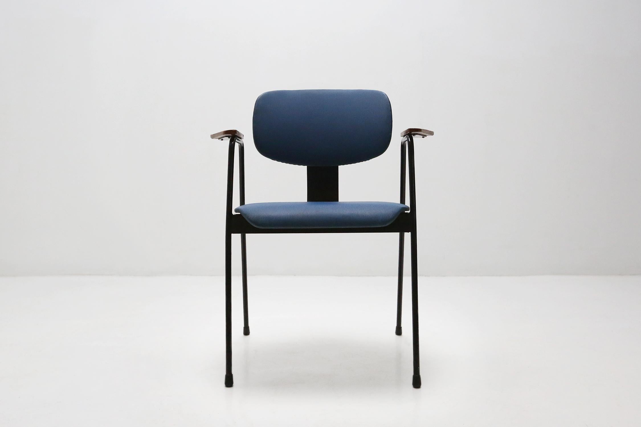 Chair by designer Willy Van Der Meeren for Tubax Ca.1950.
Has a black lacquered metal frame with blue vinyl seat.
The armrests are made of wood. Completely original and in a good vintage condition.

Van Der Meeren is considered one of the most