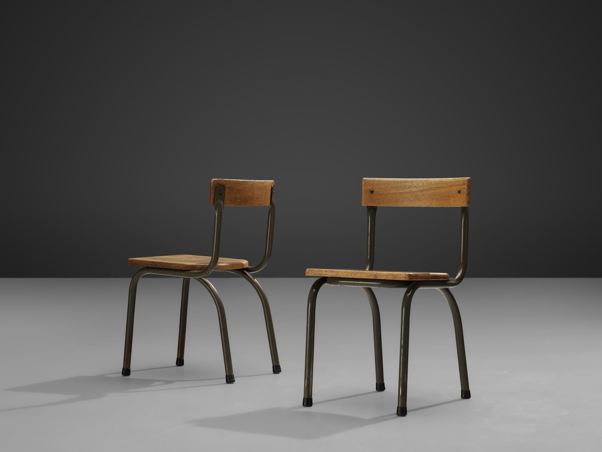 Willy Van Der Meeren for Tubax, pair of chairs, metal, oak, Belgium, 1957.

This pair of Industrial chairs is designed by the Belgian designer Willy Van Der Meeren. The exceptional elements of these chairs is the fact that they are made of solid