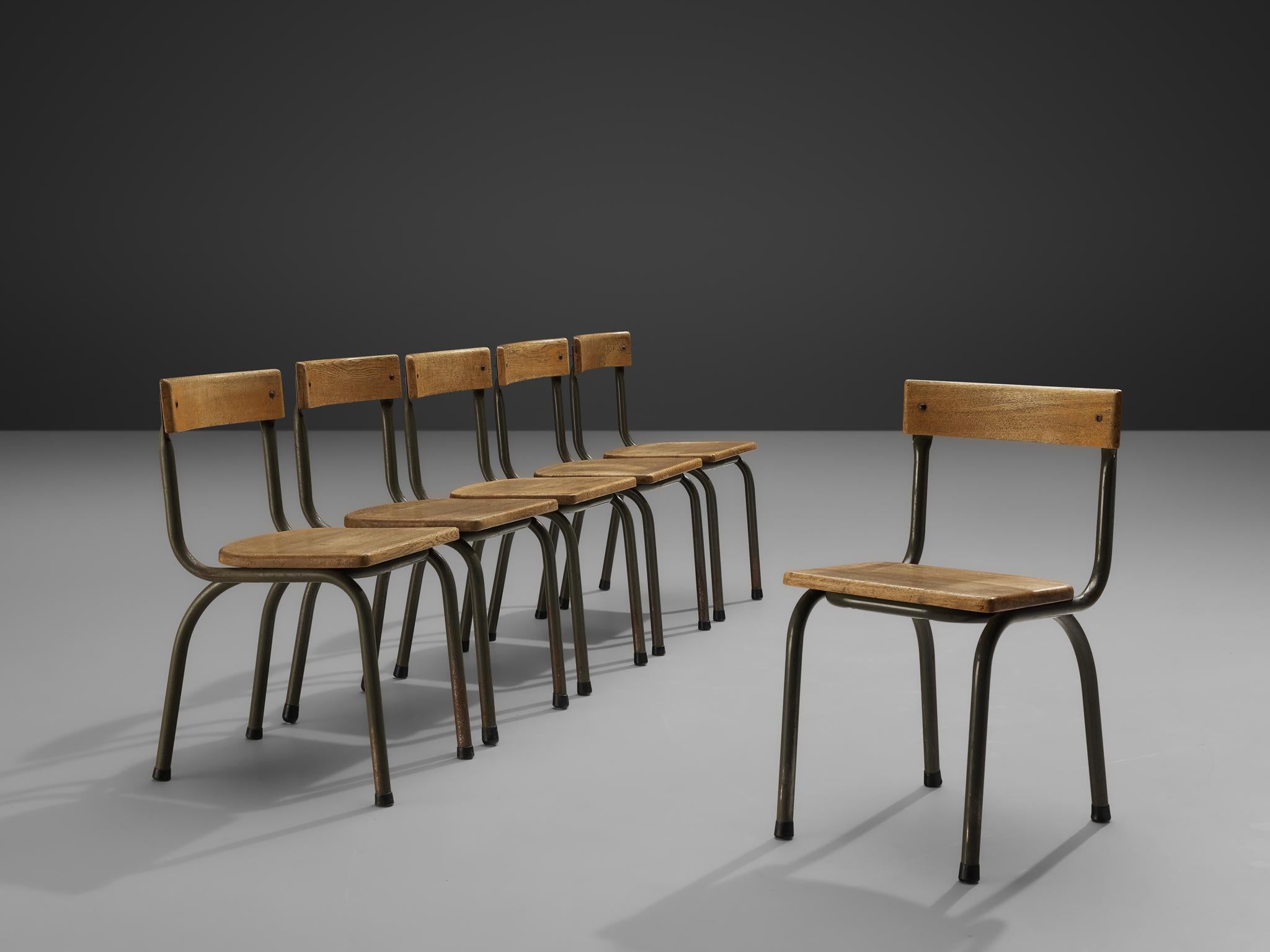 Willy Van Der Meeren for Tubax, set of six chairs, metal, oak, Belgium, 1957.

This set of industrial chairs is designed by the Belgian designer Willy Van Der Meeren. These sober yet interesting and moody set of chairs features a seat- and backrest