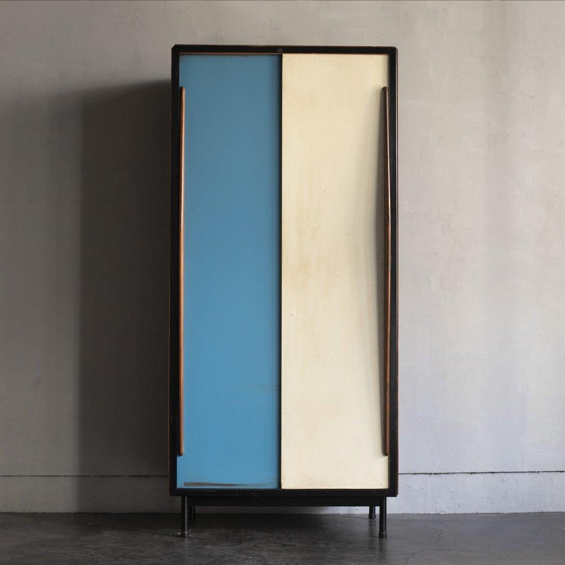 Circa 1950s / Belgium
Size W805 D540 H1750 mm

This wardrobe was designed by Belgian designer Willy Van Da Meeren and dates from the 1950s. The doors are made of steel painted in bright blue and white with wooden handles, typical of Belgian