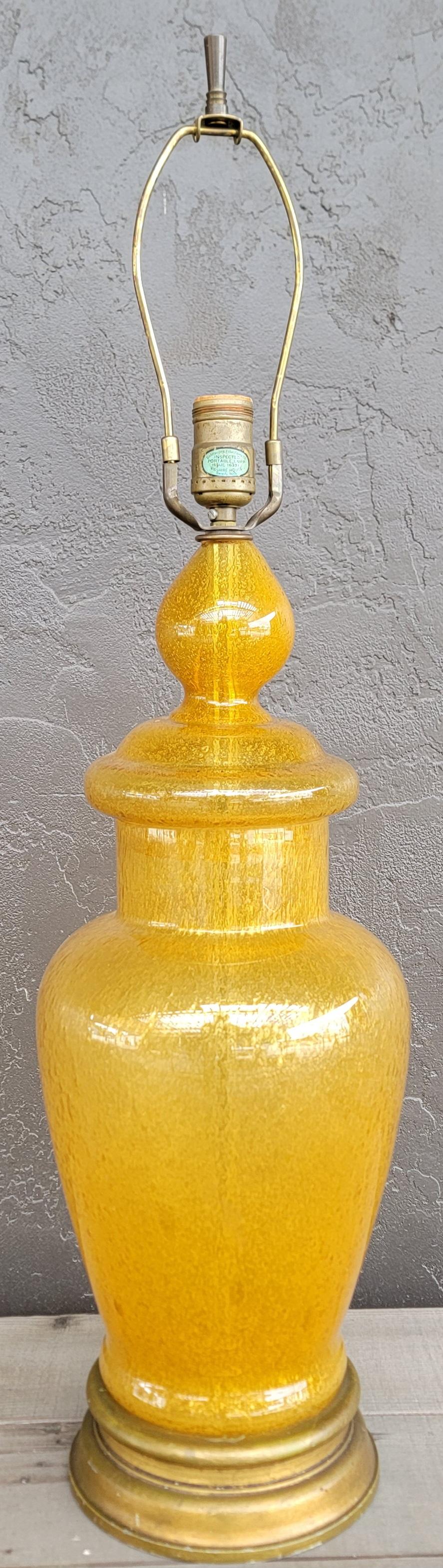 Fine bubble glass table lamps by Wilshire House, Beverly Hills, California. Mounted to wooden base. Original harp and finial. Working condition. In the manner of Murano Glass.

7.5 inch diameter.
30.5 inches high.

NO SHADE