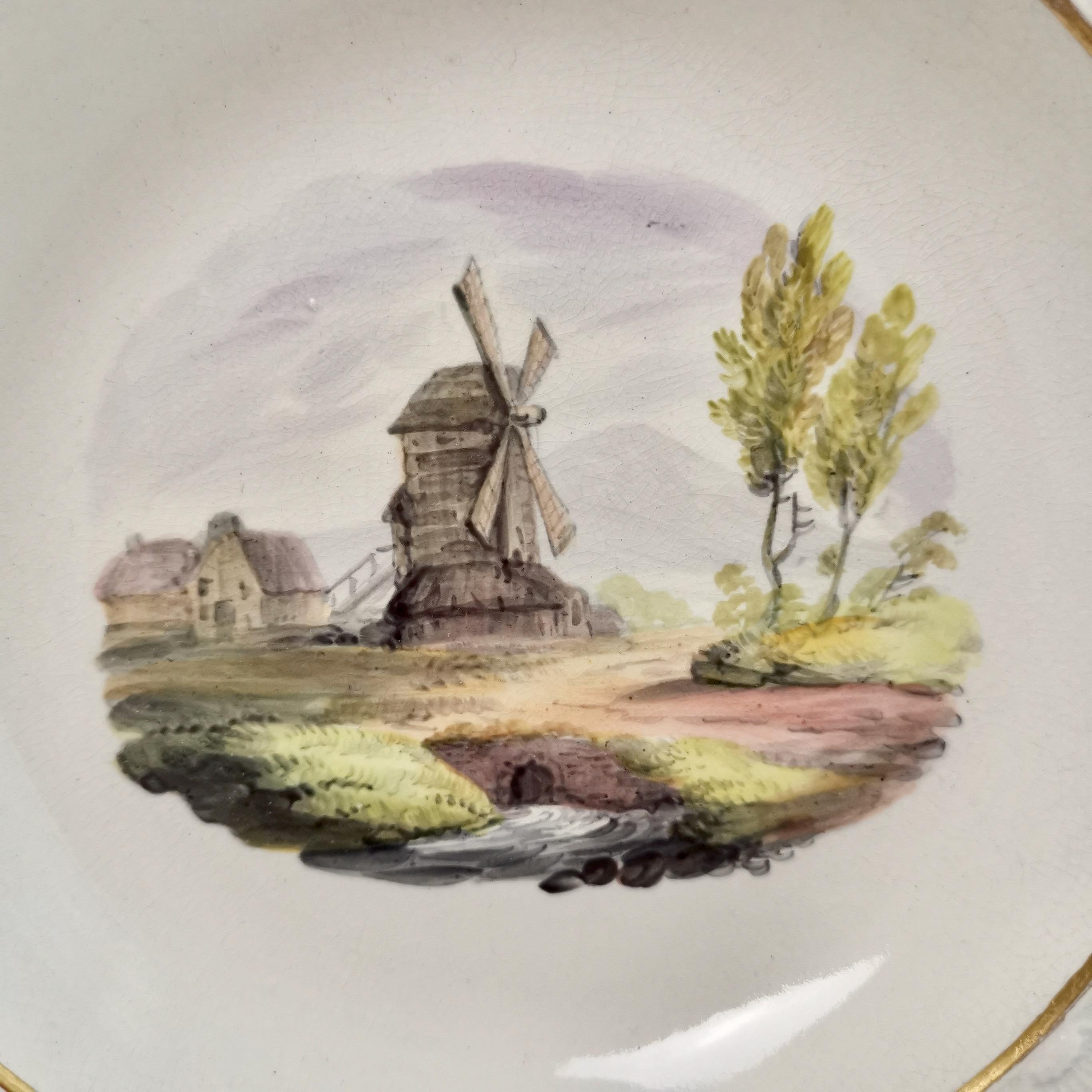 This is a very rare deep plate made by Robert Wilson in about 1800. The plate is made of creamware and has a gorgeous blind moulded rim, and a named view of a windmill in Dulwich in the centre.
 
The Robert Wilson pottery operated in Hanley,