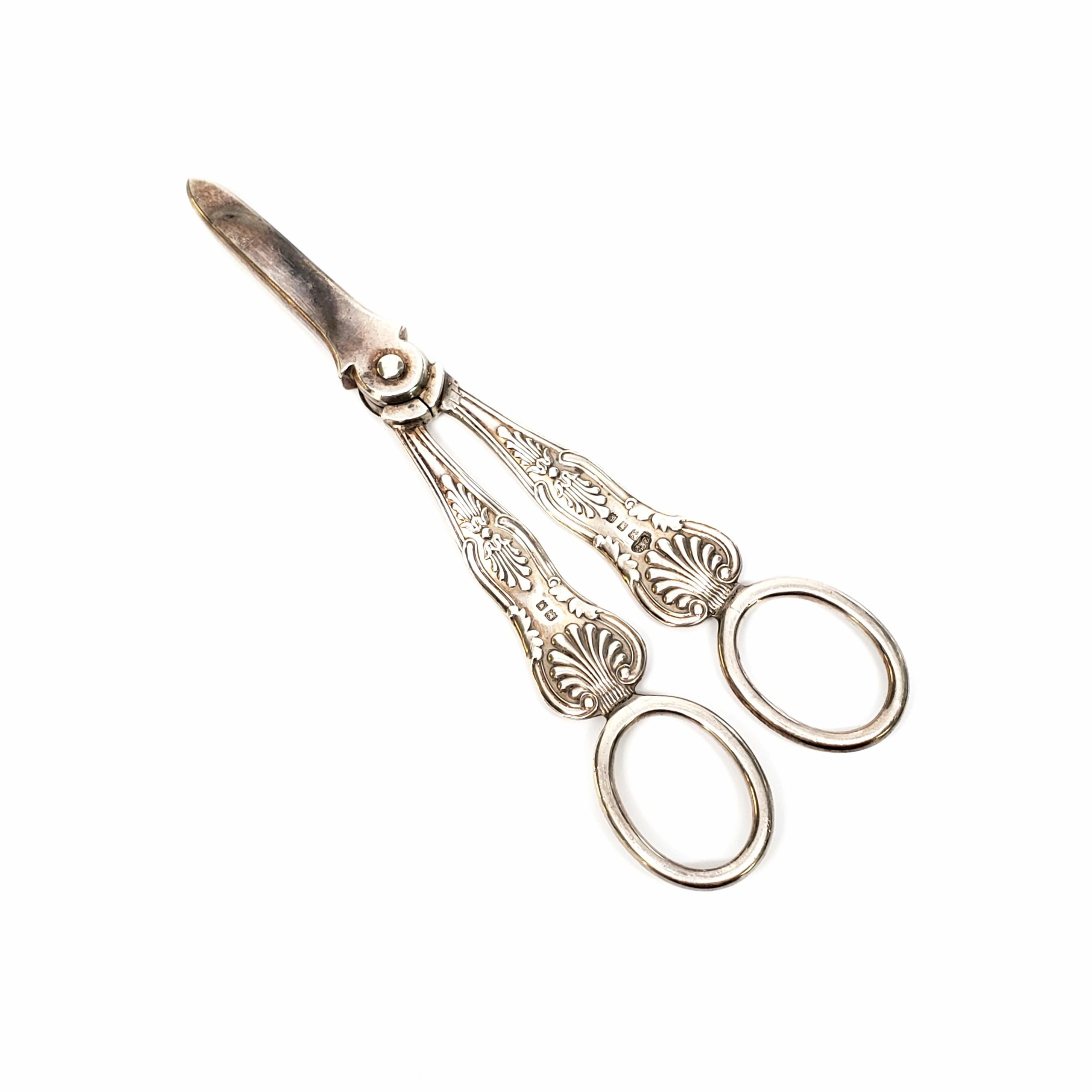 Vintage sterling silver grape shears by Wilson & Gill, circa 1922.

Wilson & Gill of Regent Street in London, were silversmiths of the late Victorian period who produced elegant and beautiful trinkets and centerpieces. These King's pattern grape