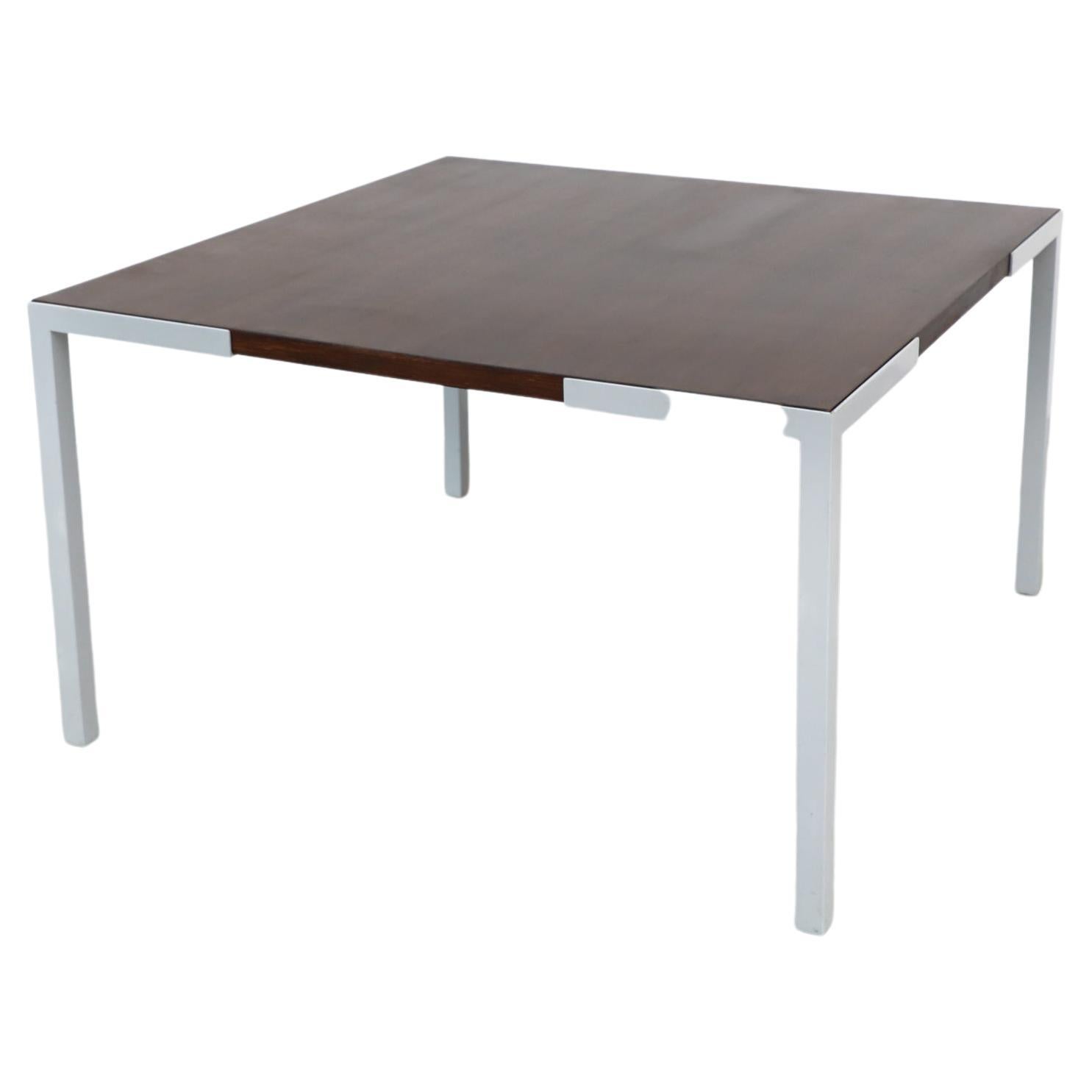 Simple, austere Wim den Boon square square dining table with wenge top and enameled metal legs. The wenge top is inset in the enameled steel leg frames. In good condition with visible wear, including some scratches.