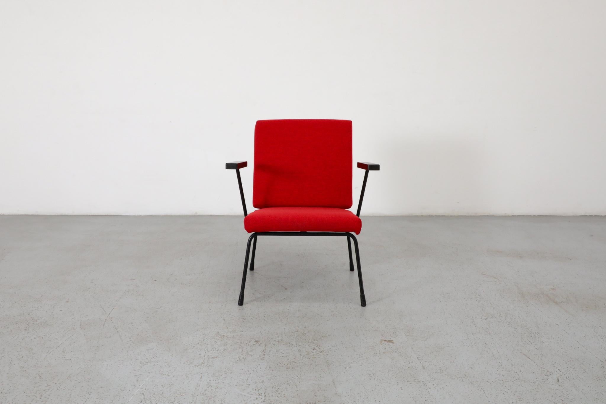 Wim Rietveld 1401 lounge chair for Gispen. Original enameled sheet metal frame with classic Bakelite arm rests and upholstered in new crimson fabric. Others available in assorted colors and listed separately.
