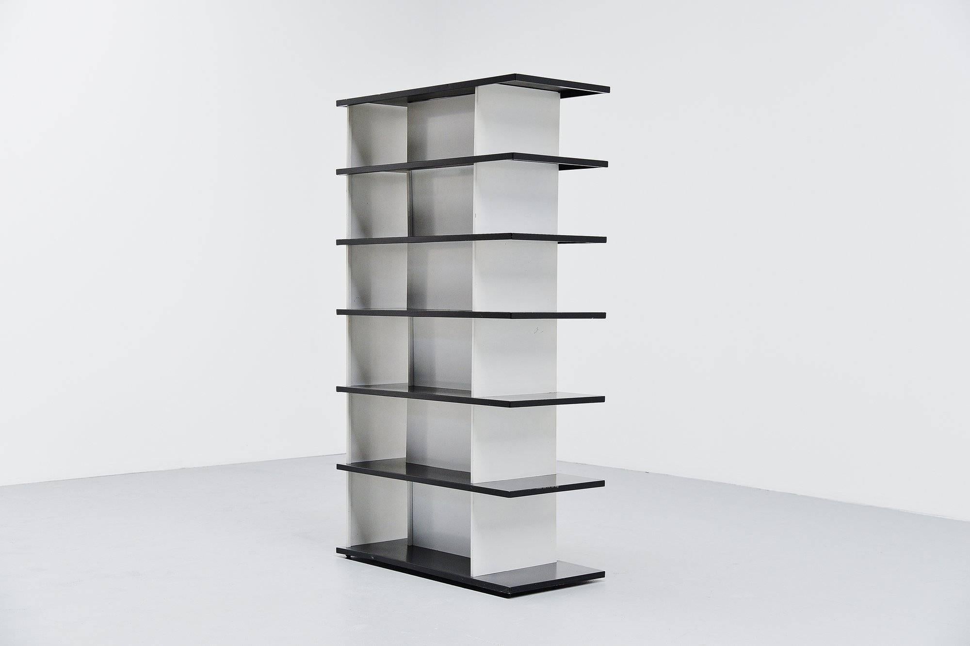 Very impressive bookcase or room divider designed by Industrial designer Wim Rietveld, son of Gerrit Rietveld. The origin of this bookcase was a big question, but it was made for exclusive department store De Bijenkorf in 1960. De Bijenkorf sold a