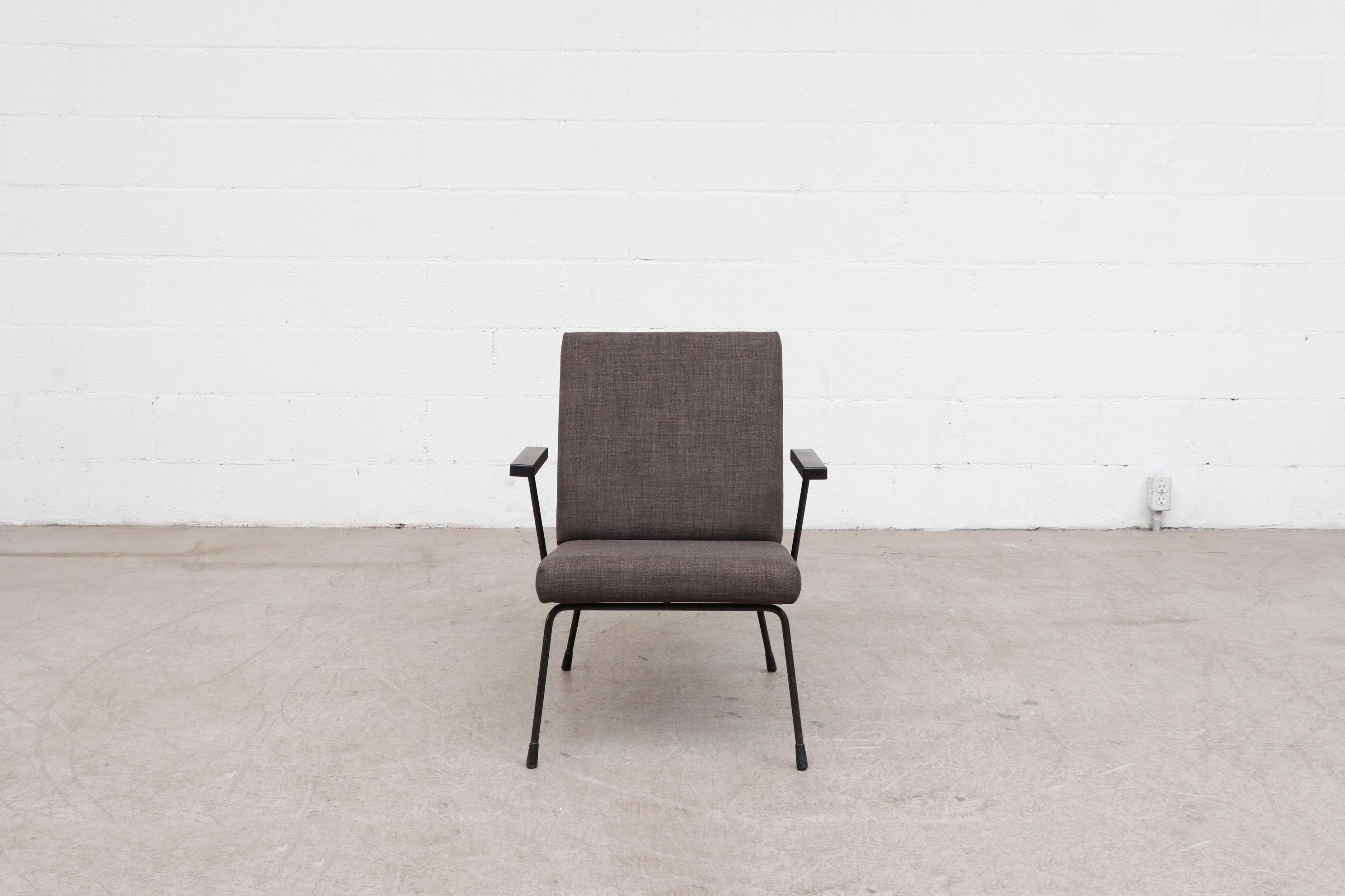 1950s Wim Rietveld lounge chair for Gispen with new charcoal grey upholstery and black enameled metal frame. In original condition with bakelite arms and some visible wear and scratching. Other Wim Rietveld lounge chairs (LU922421645382 and