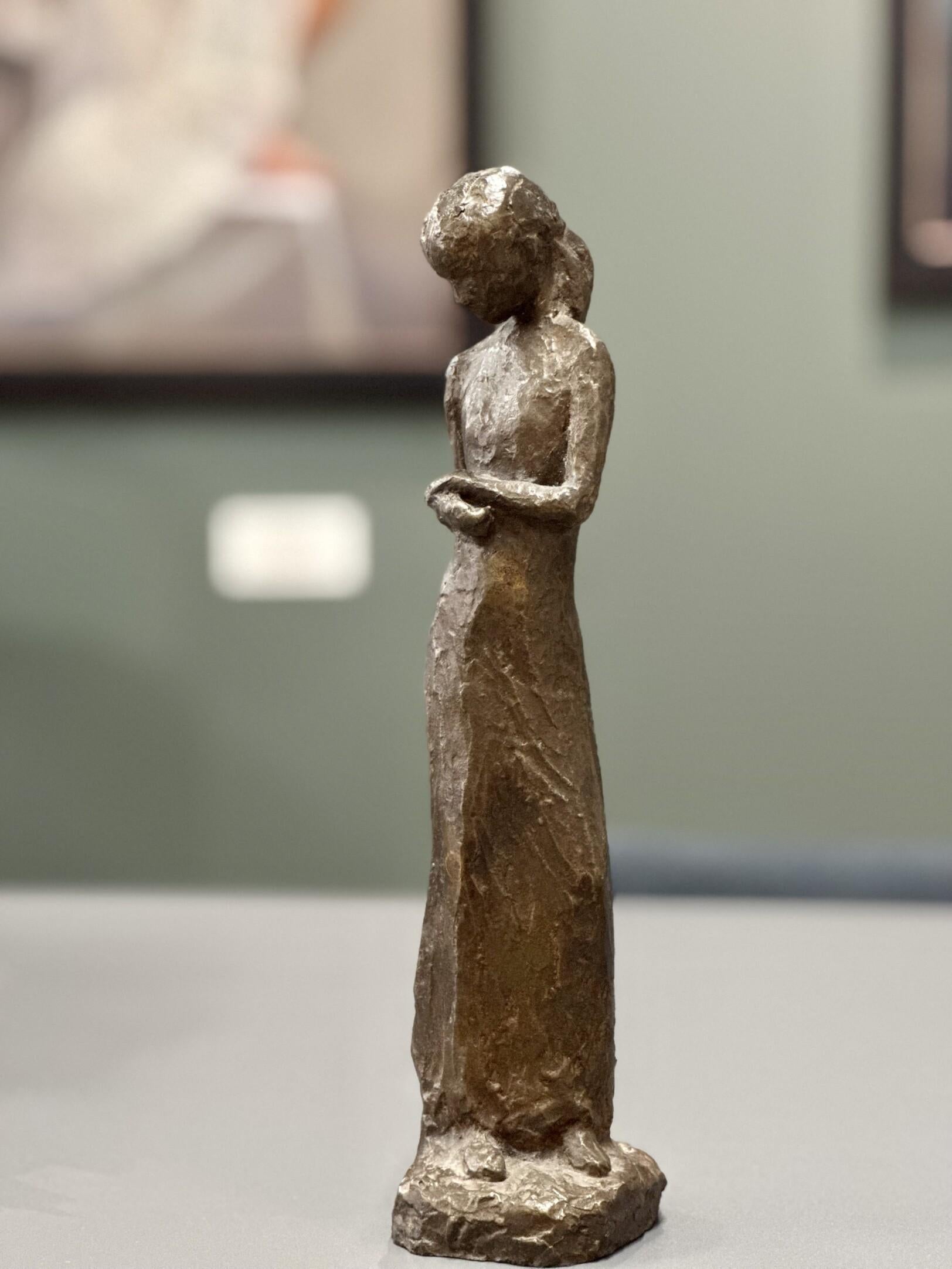 Daniëlle
29 x 6,5 x 6,5 cm
Bronze

The theme van der Kraan likes most is to show the growing of young girls. Living in their own world. The narrative sculptures show 'the woman' and 'the girl' withdrawn into 'the self'. The posture, the dress, the