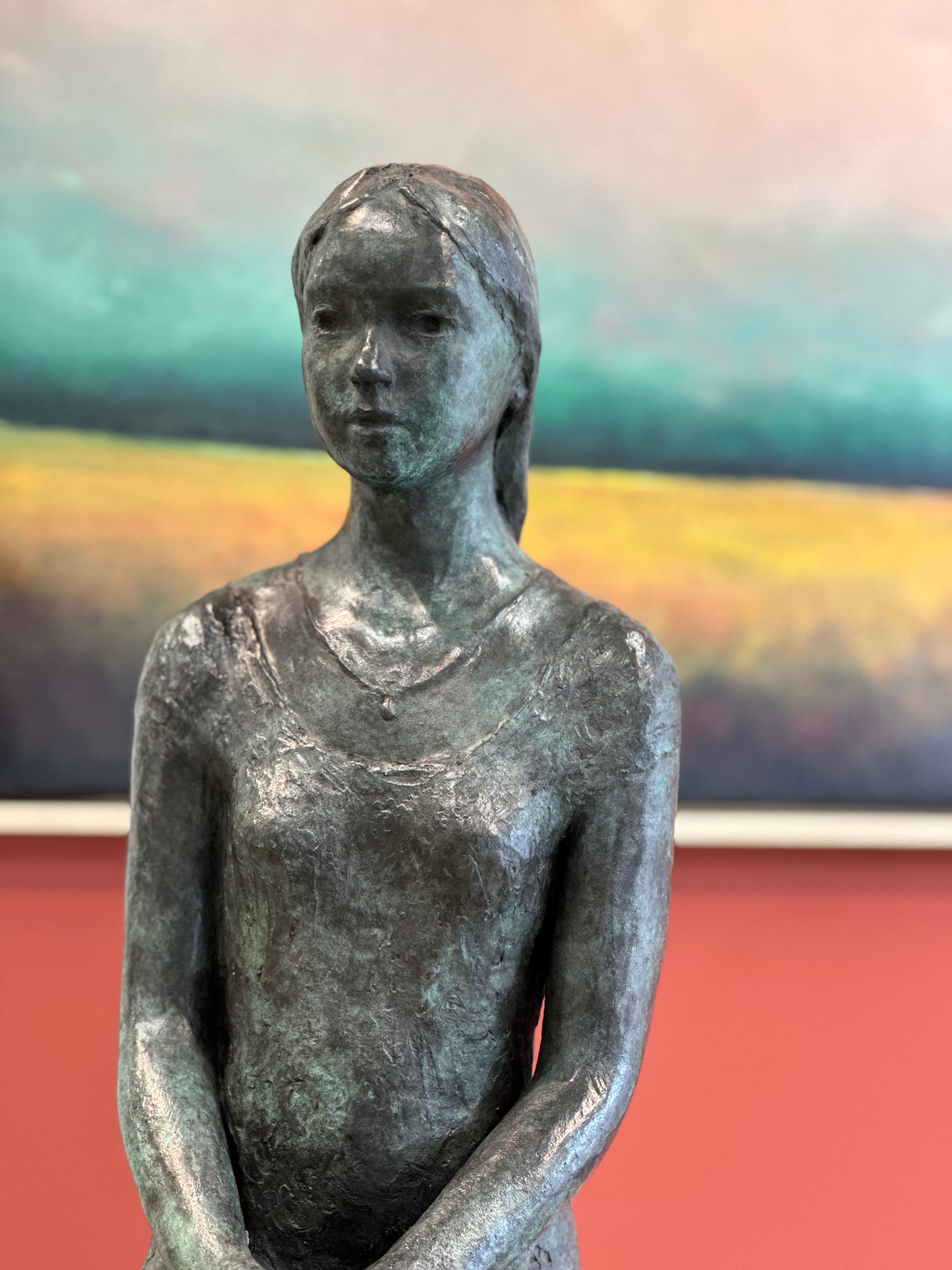 Lotte
50 x 21 x 30 cm
Bronze

The theme van der Kraan likes most is to show the growing of young girls. Living in their own world. Like this girl watching something she likes. The narrative sculptures show 'the woman' and 'the girl' withdrawn into