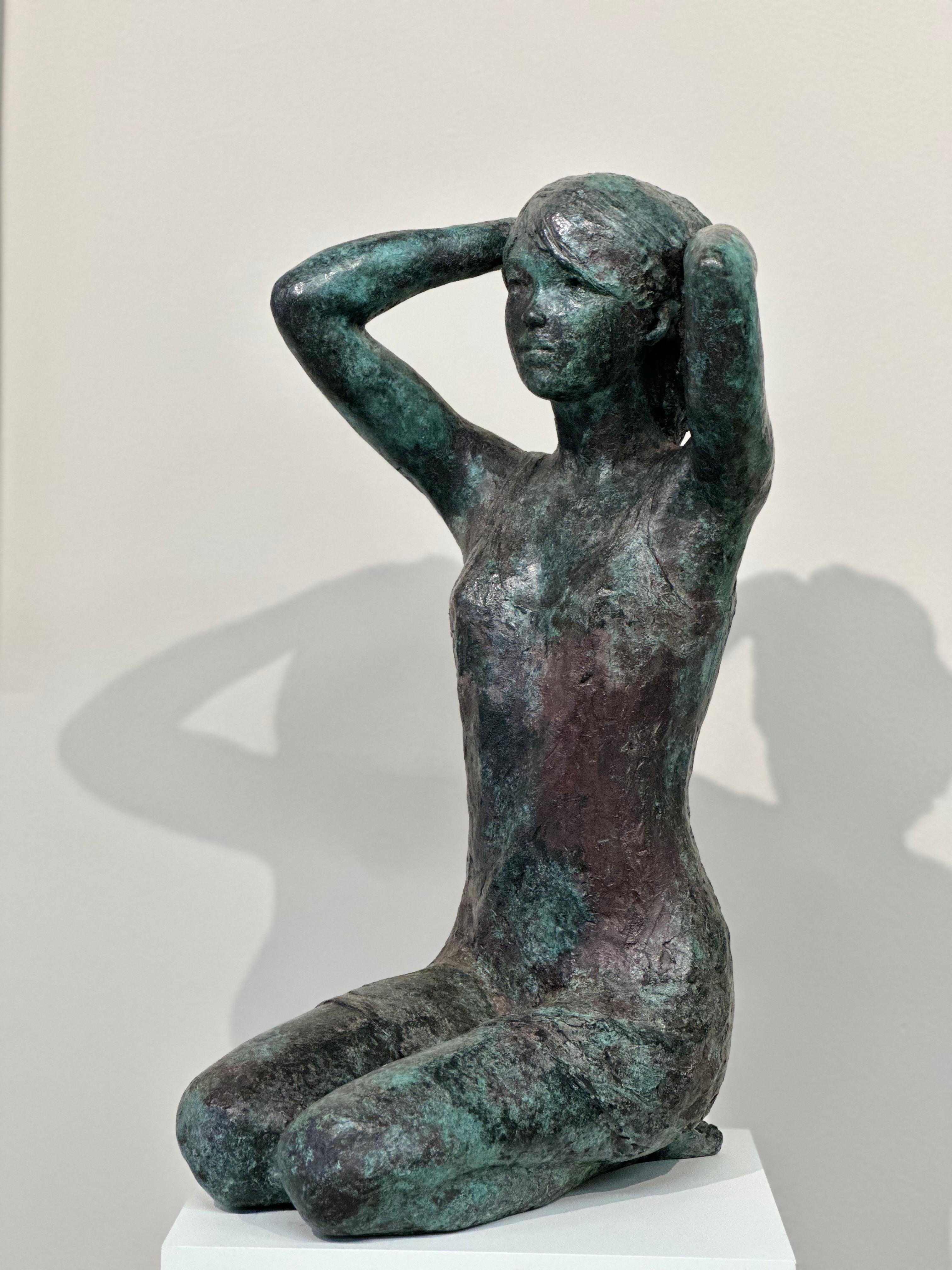 Marjo
56 x 26 x 32 cm
Bronze

The theme van der Kraan likes most is to show the growing of young girls. Living in their own world. Like this girl watching something she likes. The narrative sculptures show 'the woman' and 'the girl' withdrawn into
