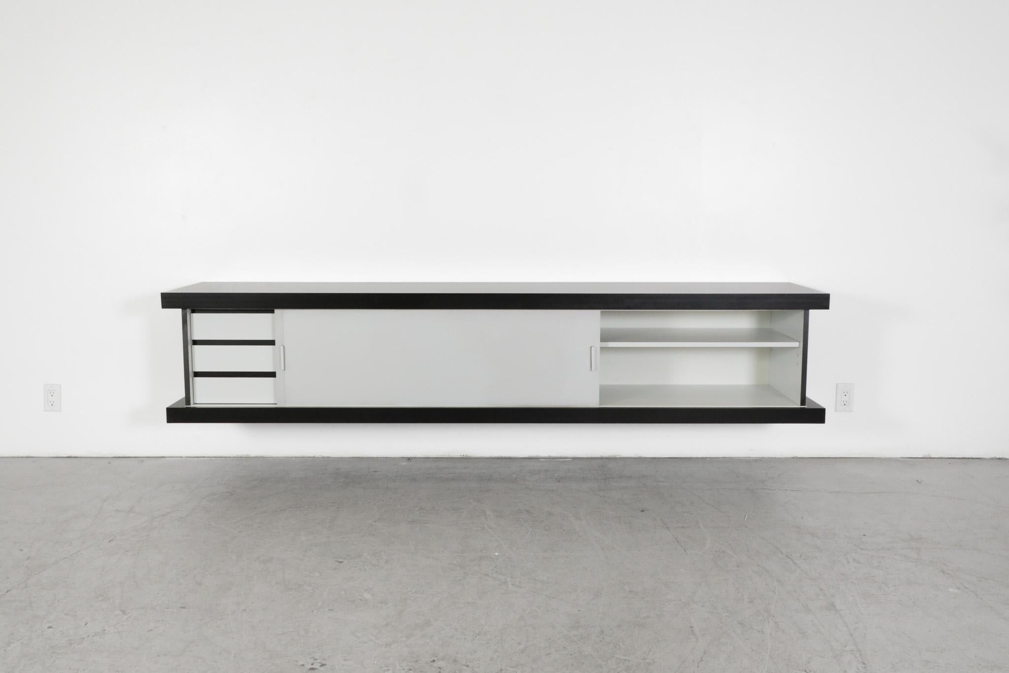 Mid-Century, floating wall mount credenza designed by Wim Wilson for Castelijn, 1964. Castelijn Meubelindustrie was founded in 1958 by Gerard Castelijn. Under his inspiring leadership, the company grew into a leading player on the furniture scene.