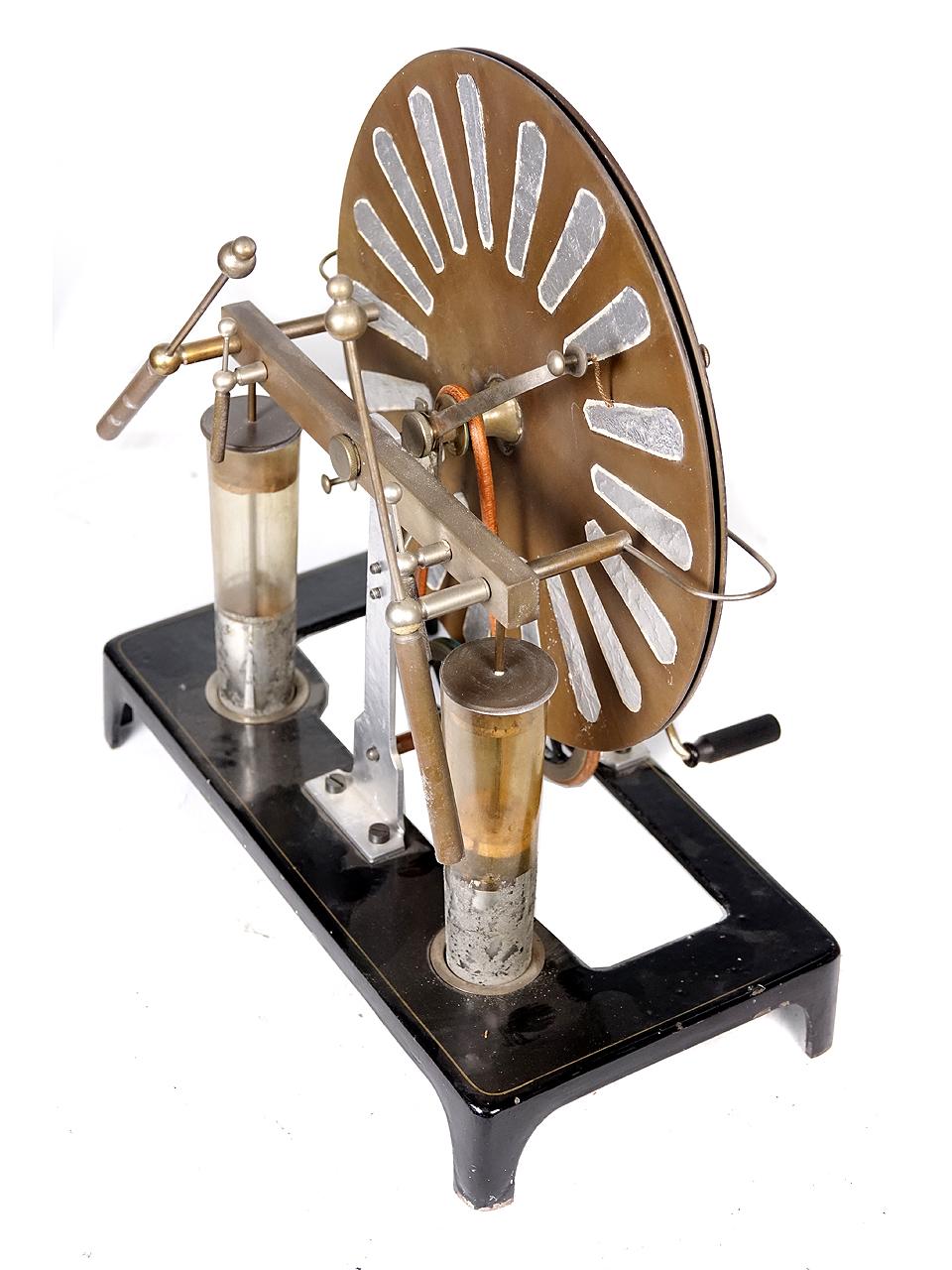 This is a small rare Edwardian Period Wimshurst Machine that is totally complete with the exception one tinfoil contact... easily replaced. It cranks and spins easily but is untested. These smaller examples were mainly used for classroom