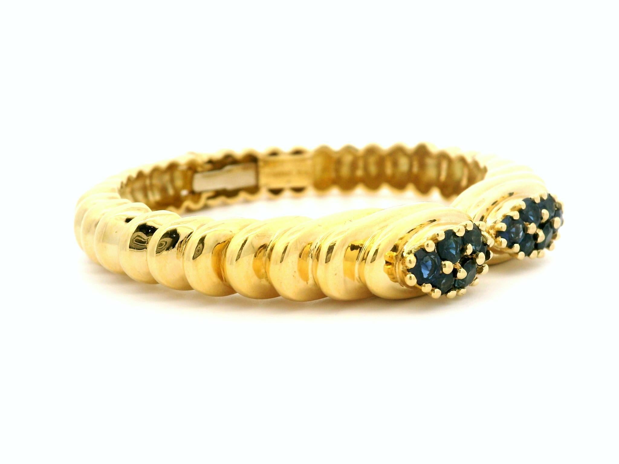 --Stone(s):--
(12) Natural Genuine Sapphires - Round Brilliant Cut - Pong Set - Royal Blue Color
Total Carat Weight: 2.40 (approx.)

Material: Solid 18k Yellow Gold
Weight: 46.39 Grams
Length: Open Top, Will Comfortably Fit Up to a 6.75 inch