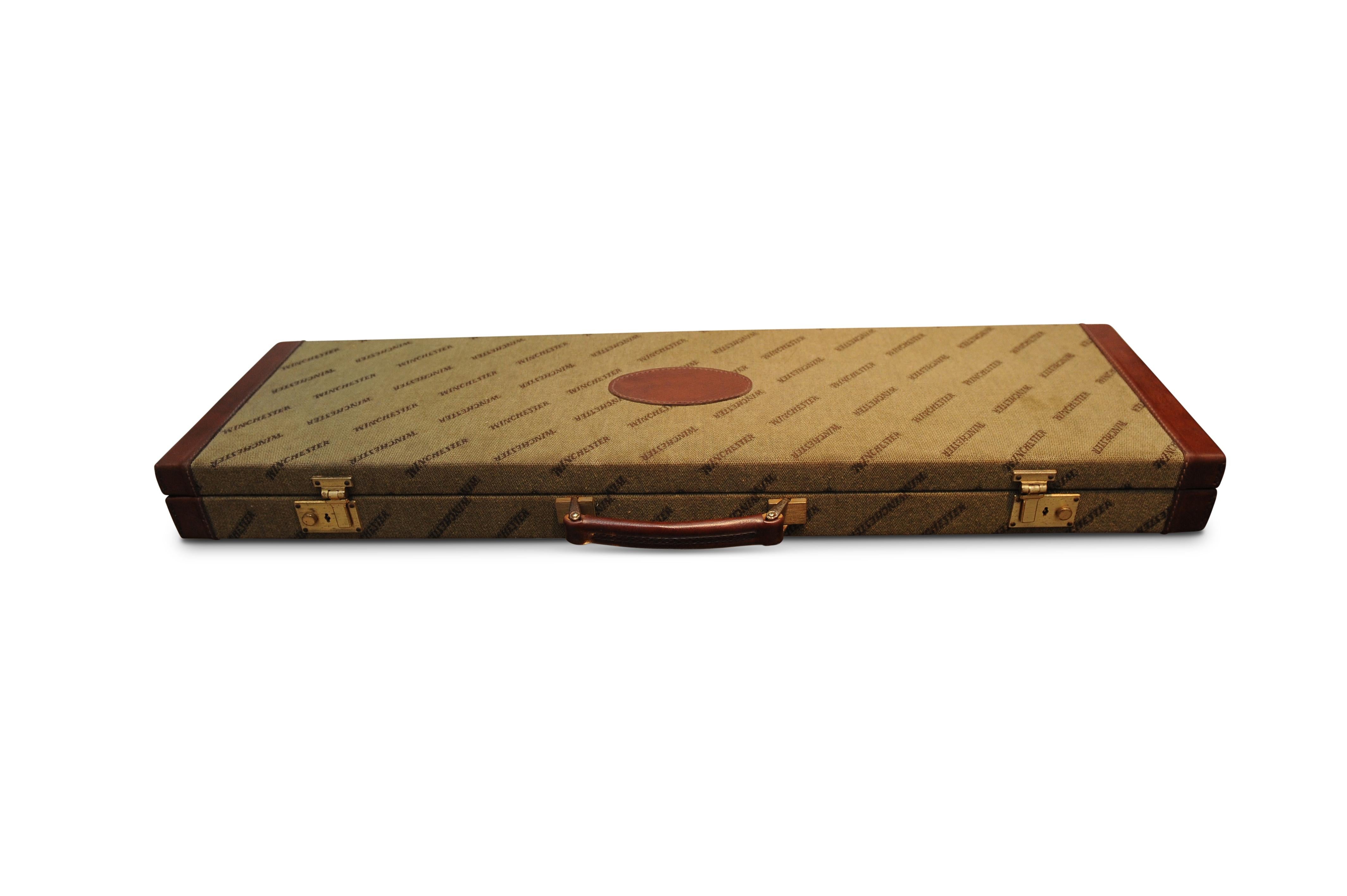 Winchester single shotgun case with red inner lining, leather trim and brass locks.

Winchester hard gun case for Winchester 23, 101 or 21, will take 28 inch barrels, leather trim, will take other brands of sxs and over under

The case is in